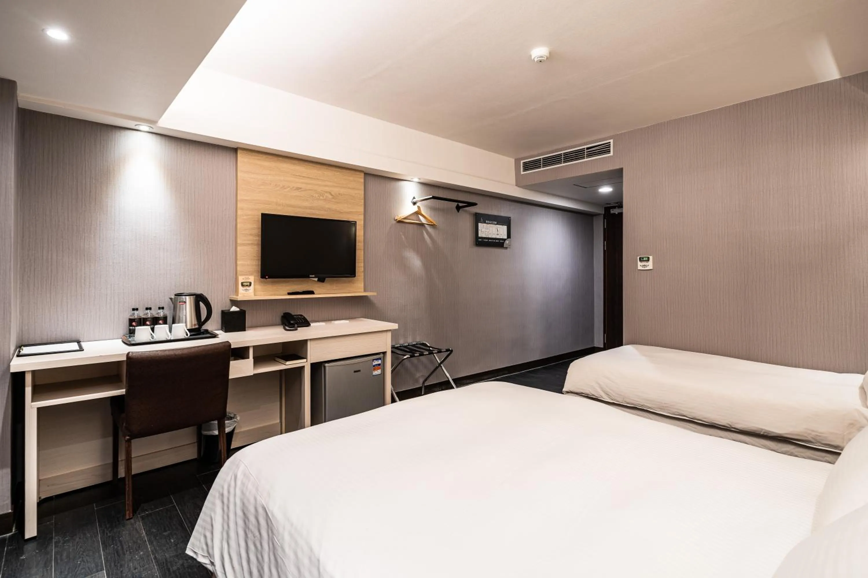 Bed in Global Traveler Hotel