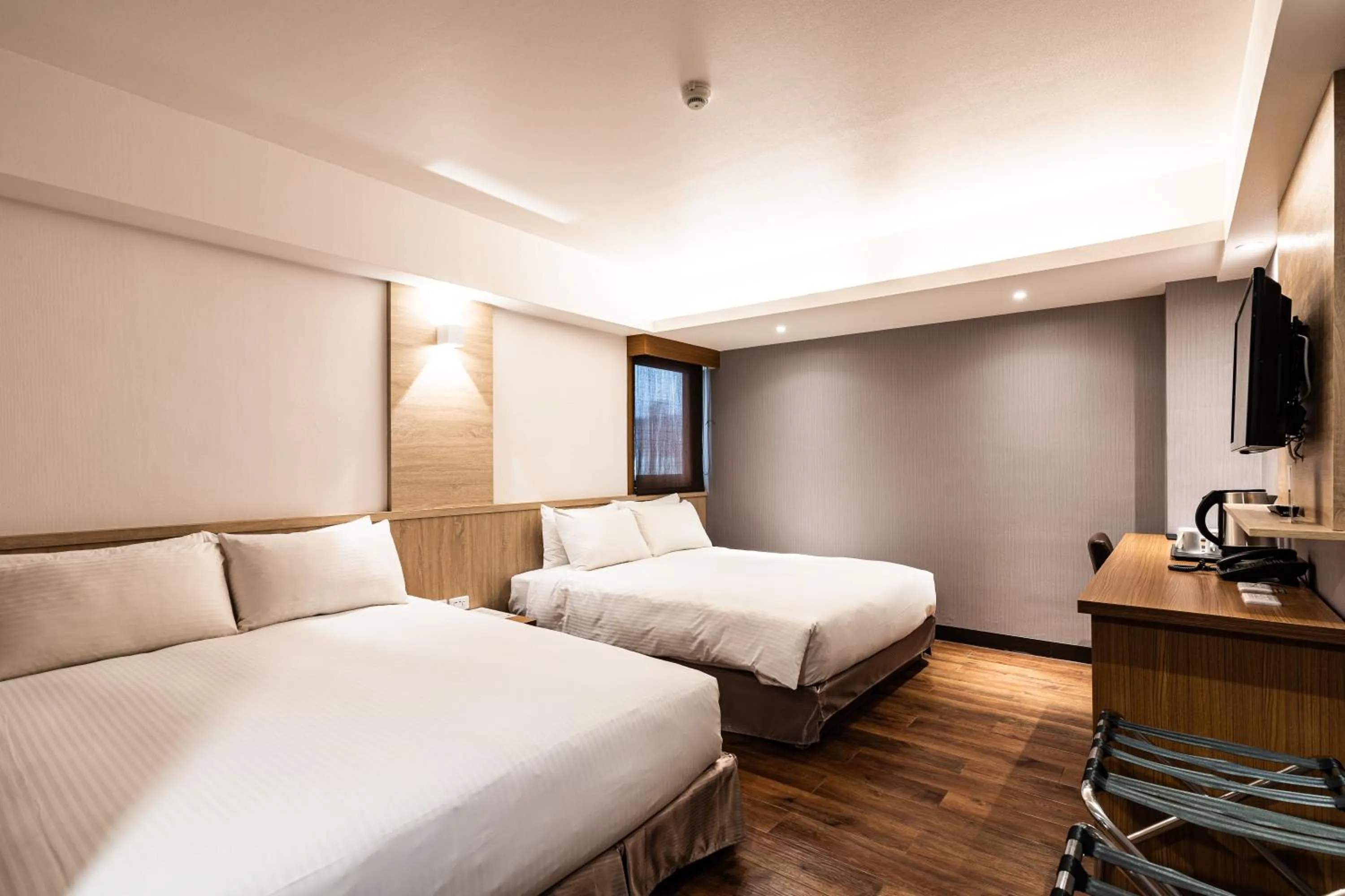 Bed in Global Traveler Hotel