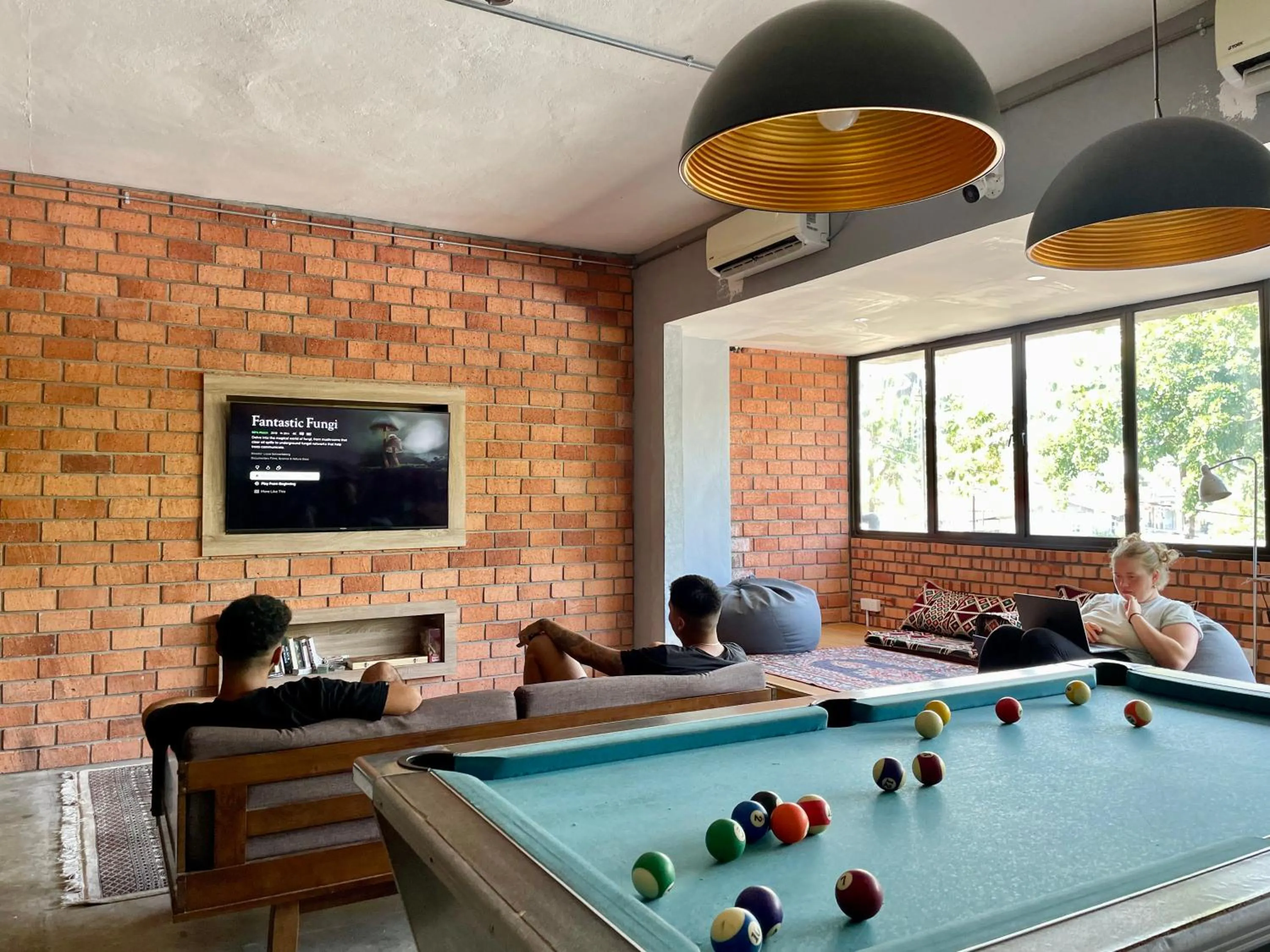 Communal lounge/ TV room in Arch Dormitorio Cenang