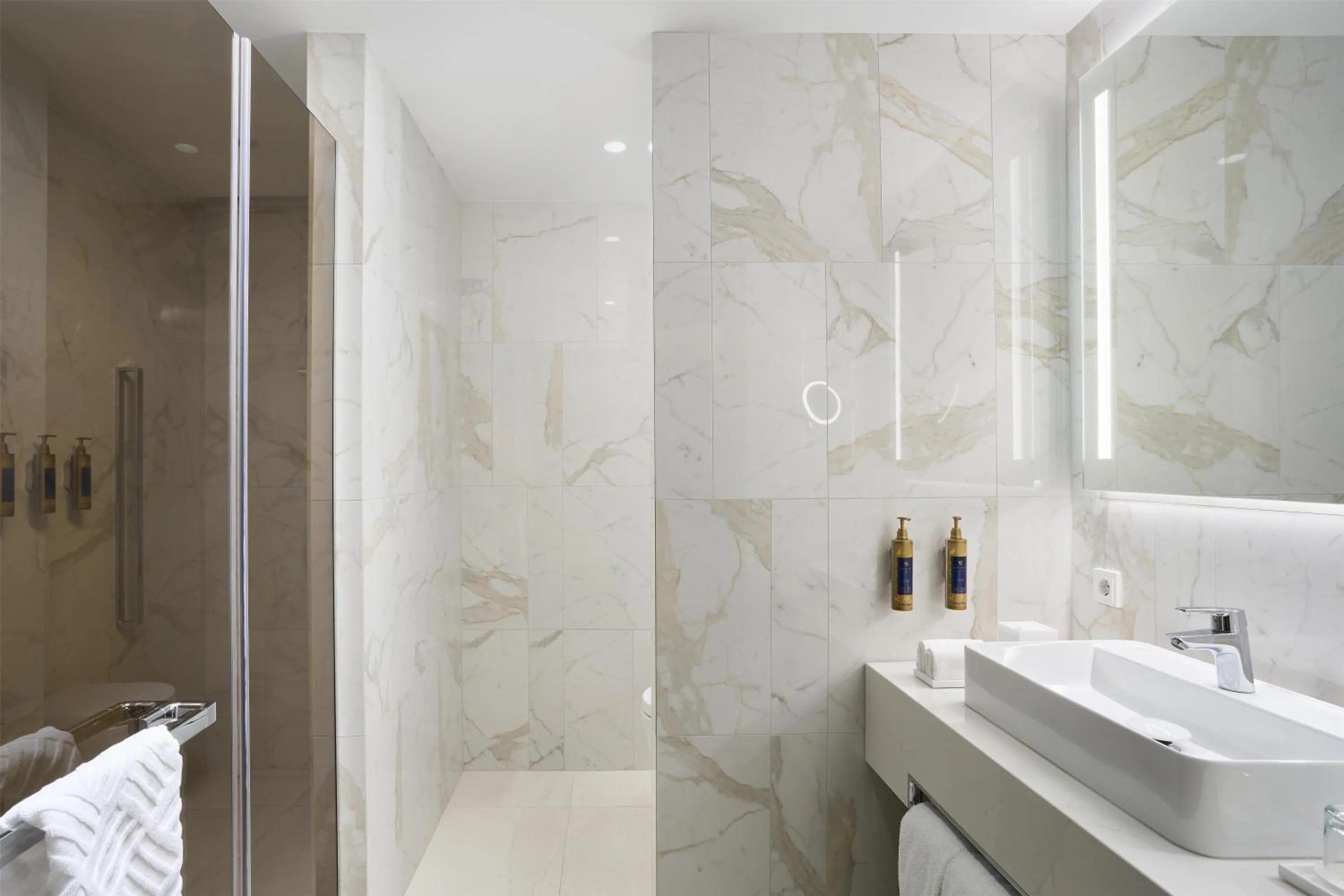 Bathroom in Iceland Parliament Hotel, Curio Collection By Hilton