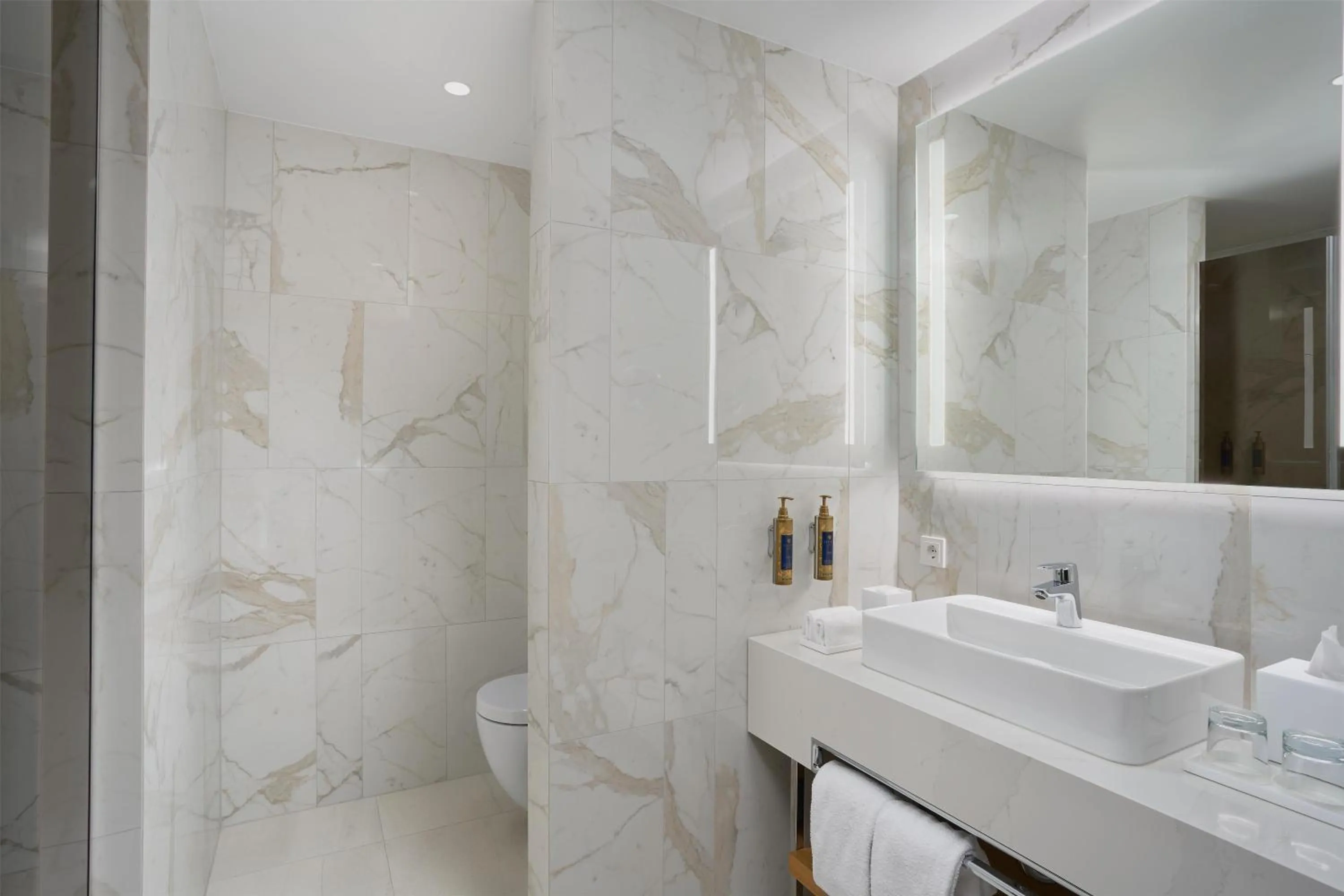 Bathroom in Iceland Parliament Hotel, Curio Collection By Hilton