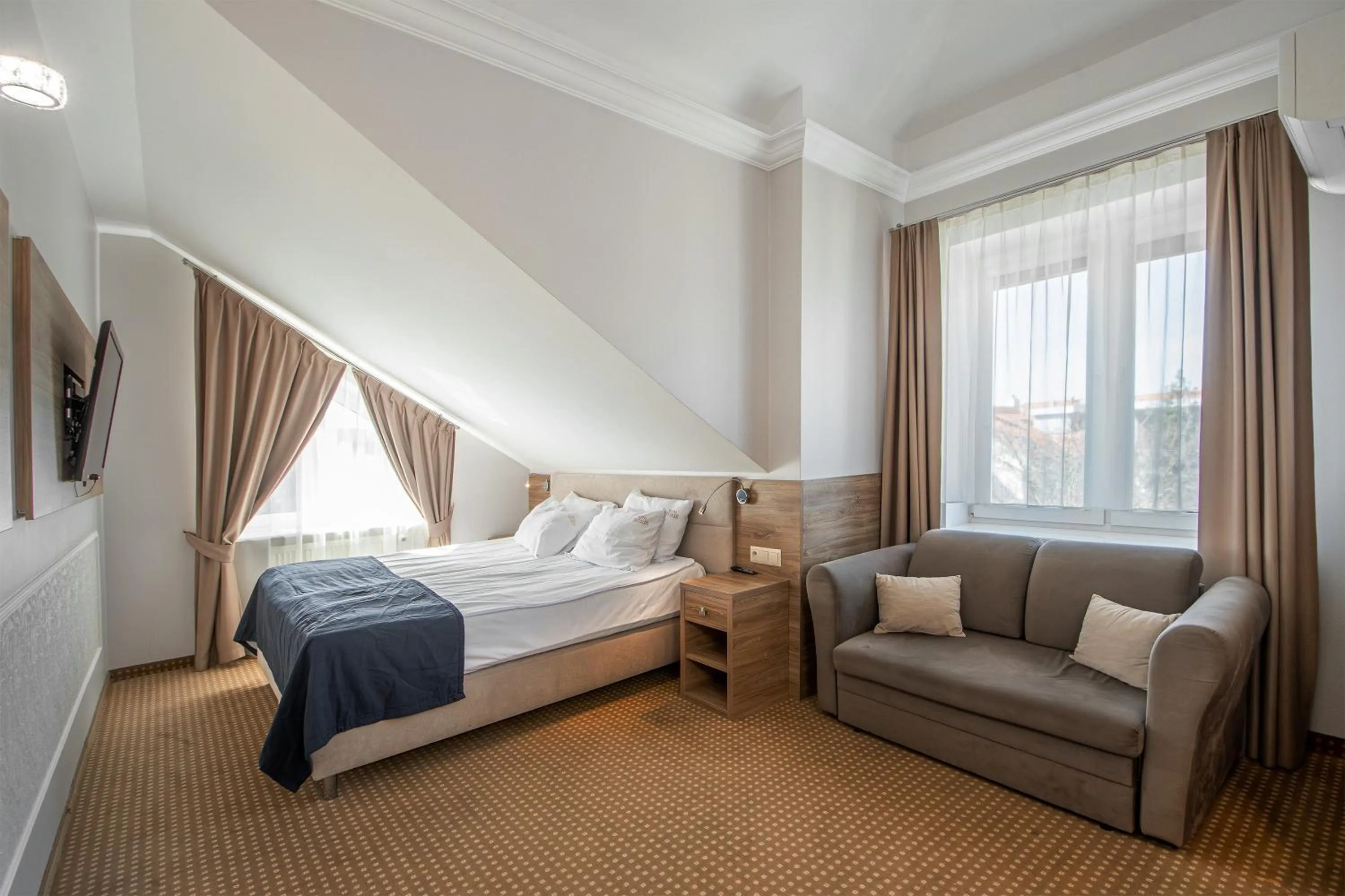 Bed in Moris Boutique Beach Hotel