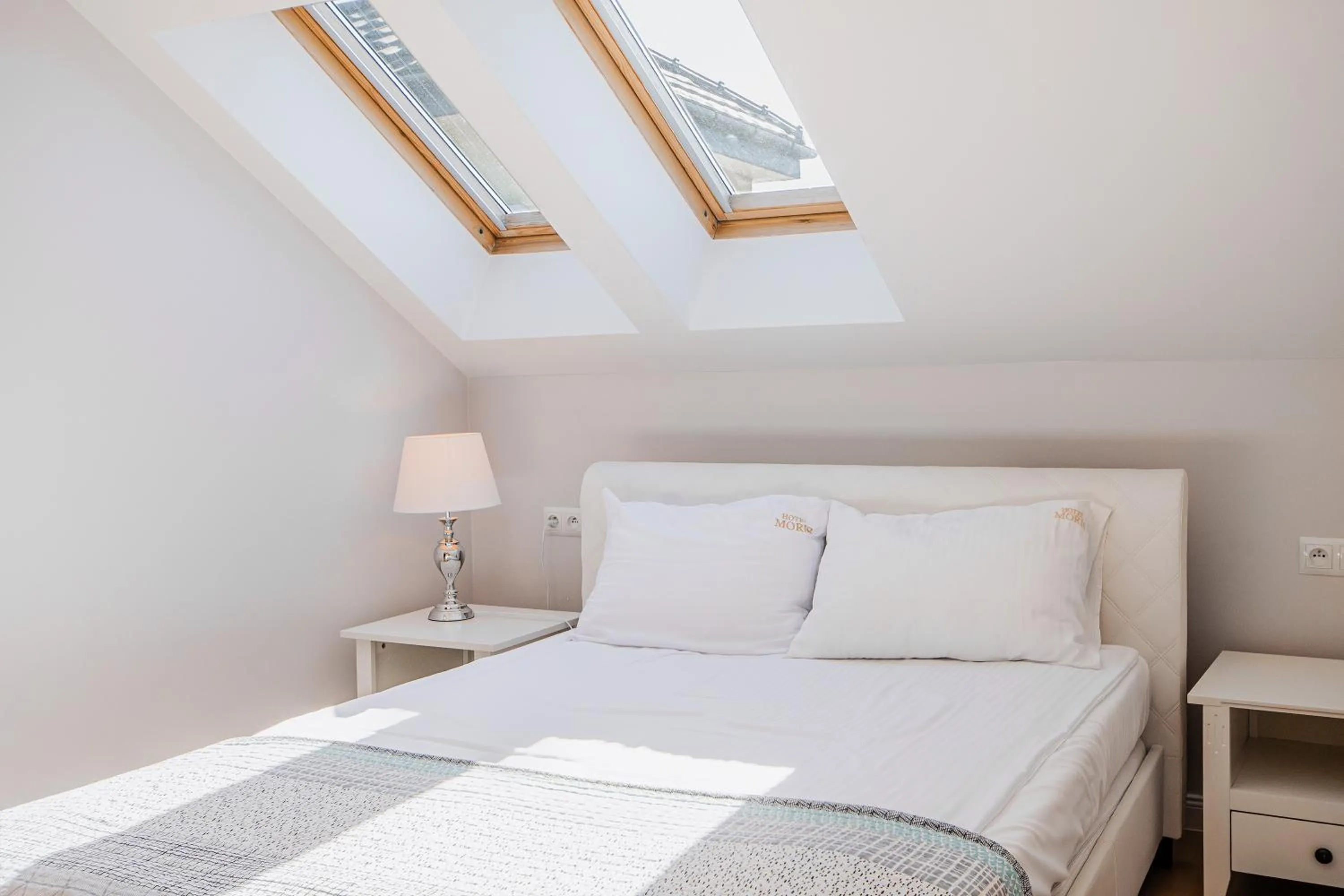 Bed in Moris Boutique Beach Hotel