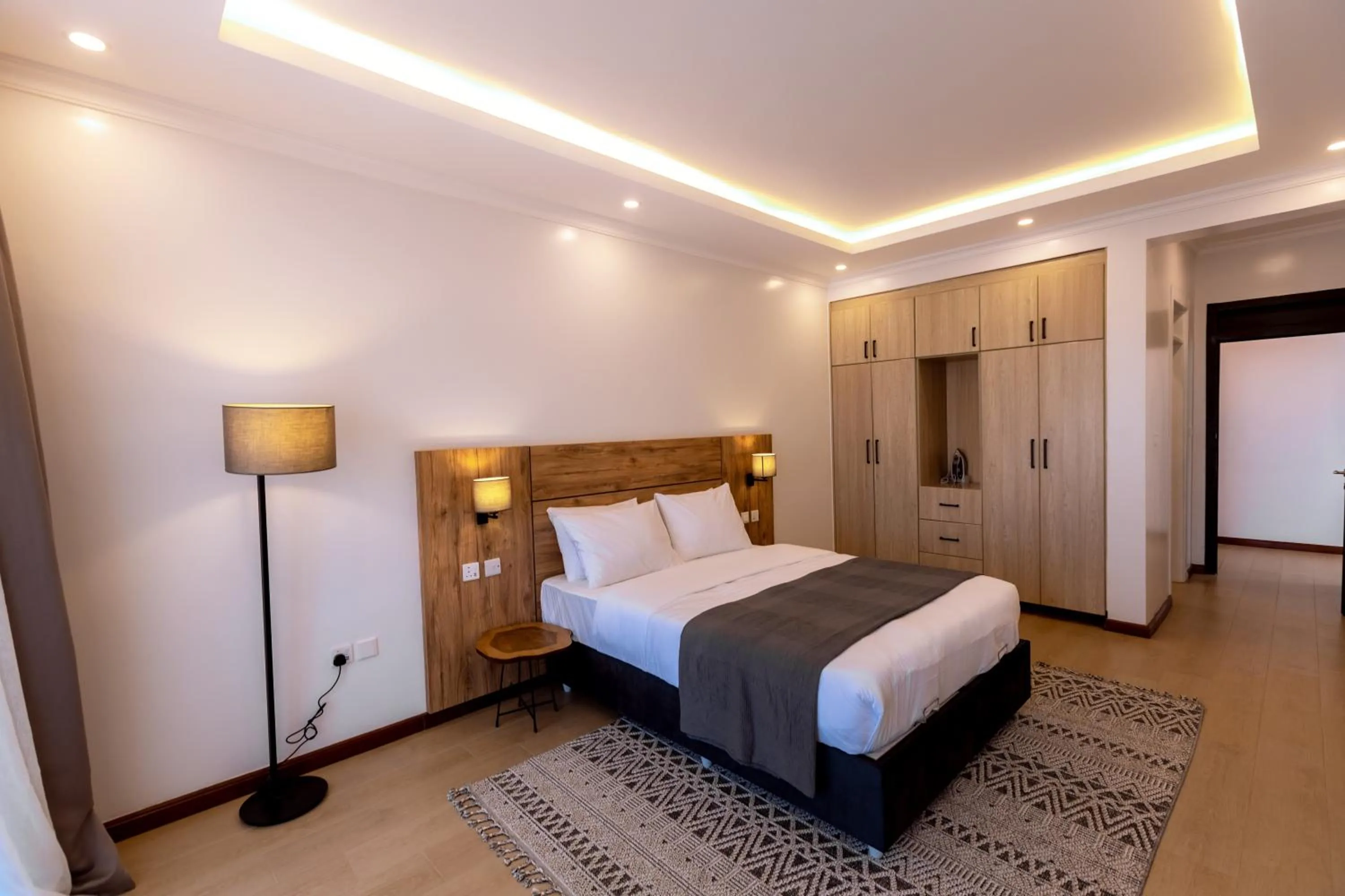 Photo of the whole room, Bed in MAYA Residences Rwanda