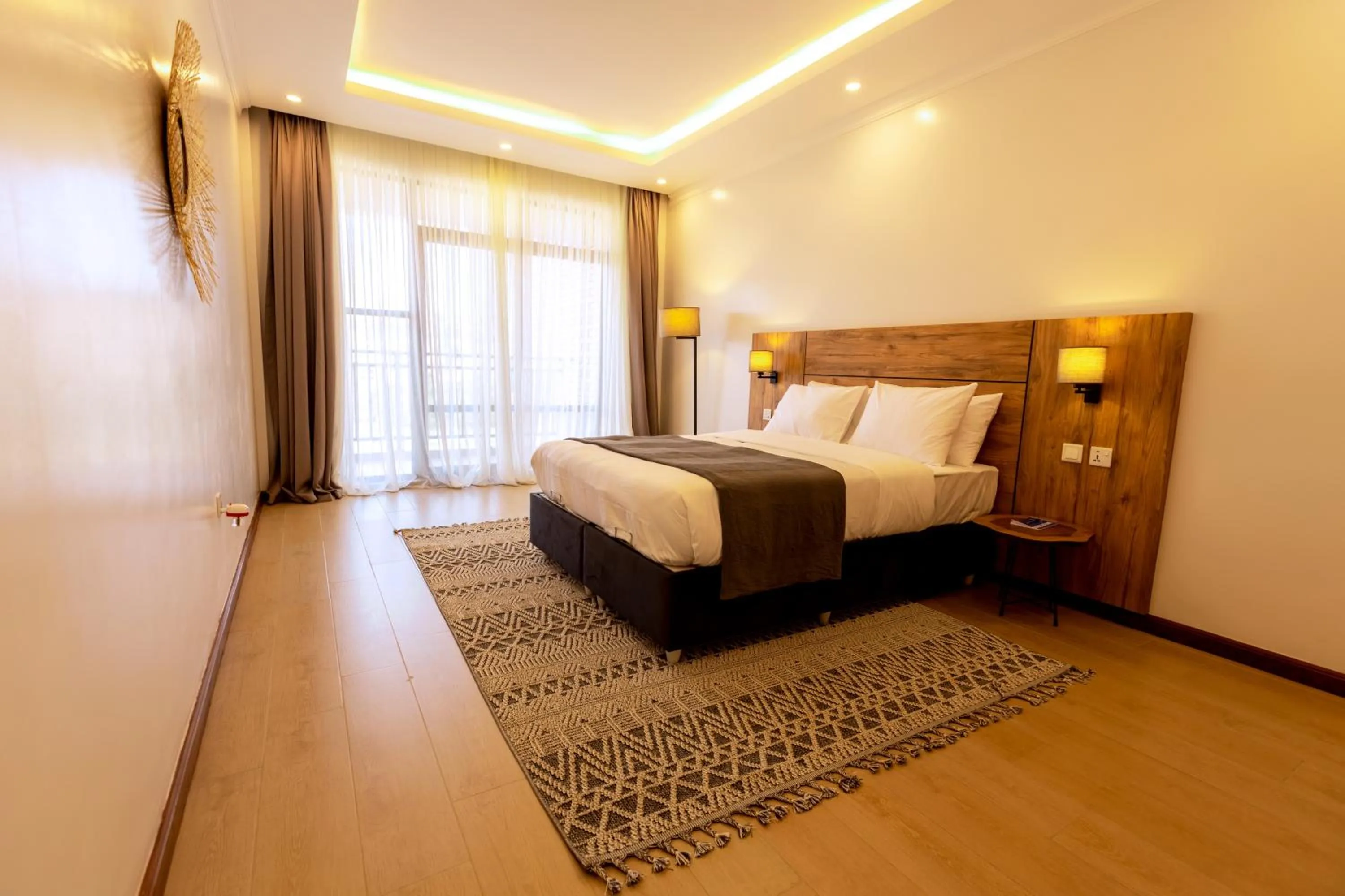 Photo of the whole room, Bed in MAYA Residences Rwanda