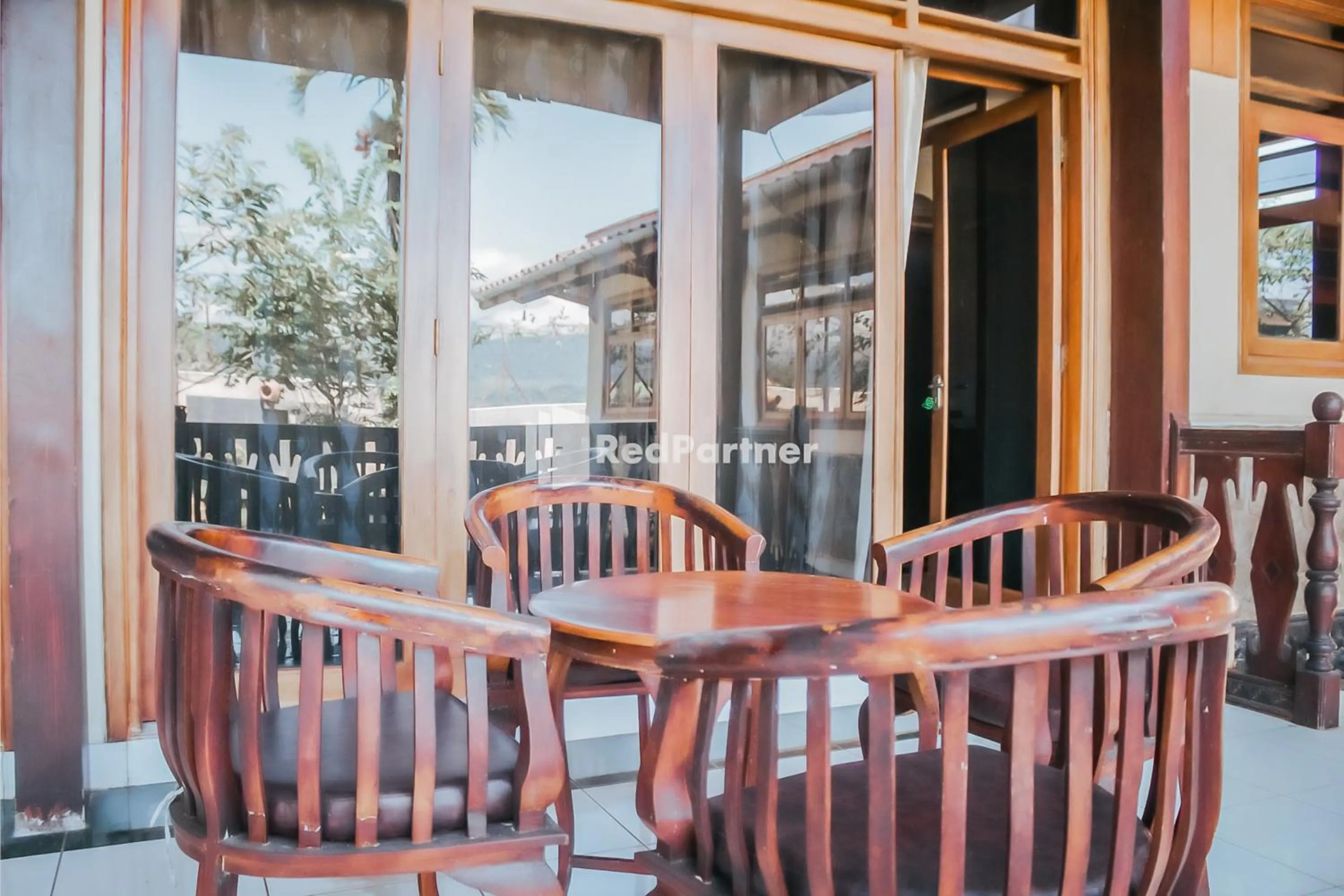 Seating area in Villa Mawar Adinda Kuningan Syariah RedPartner