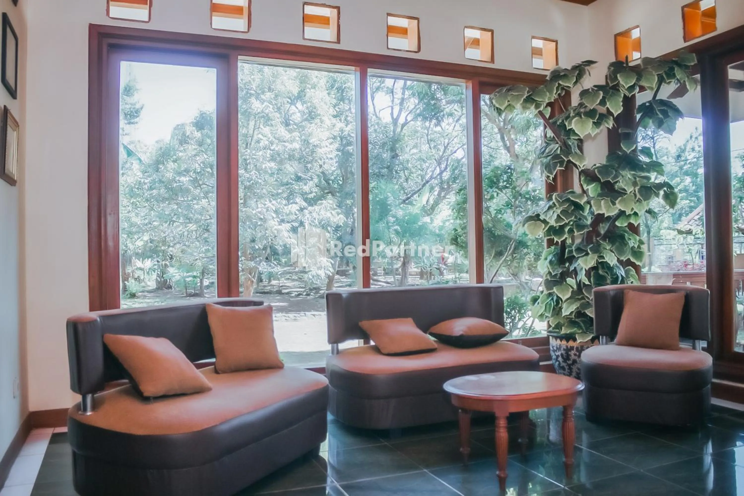 Seating area in Villa Mawar Adinda Kuningan Syariah RedPartner