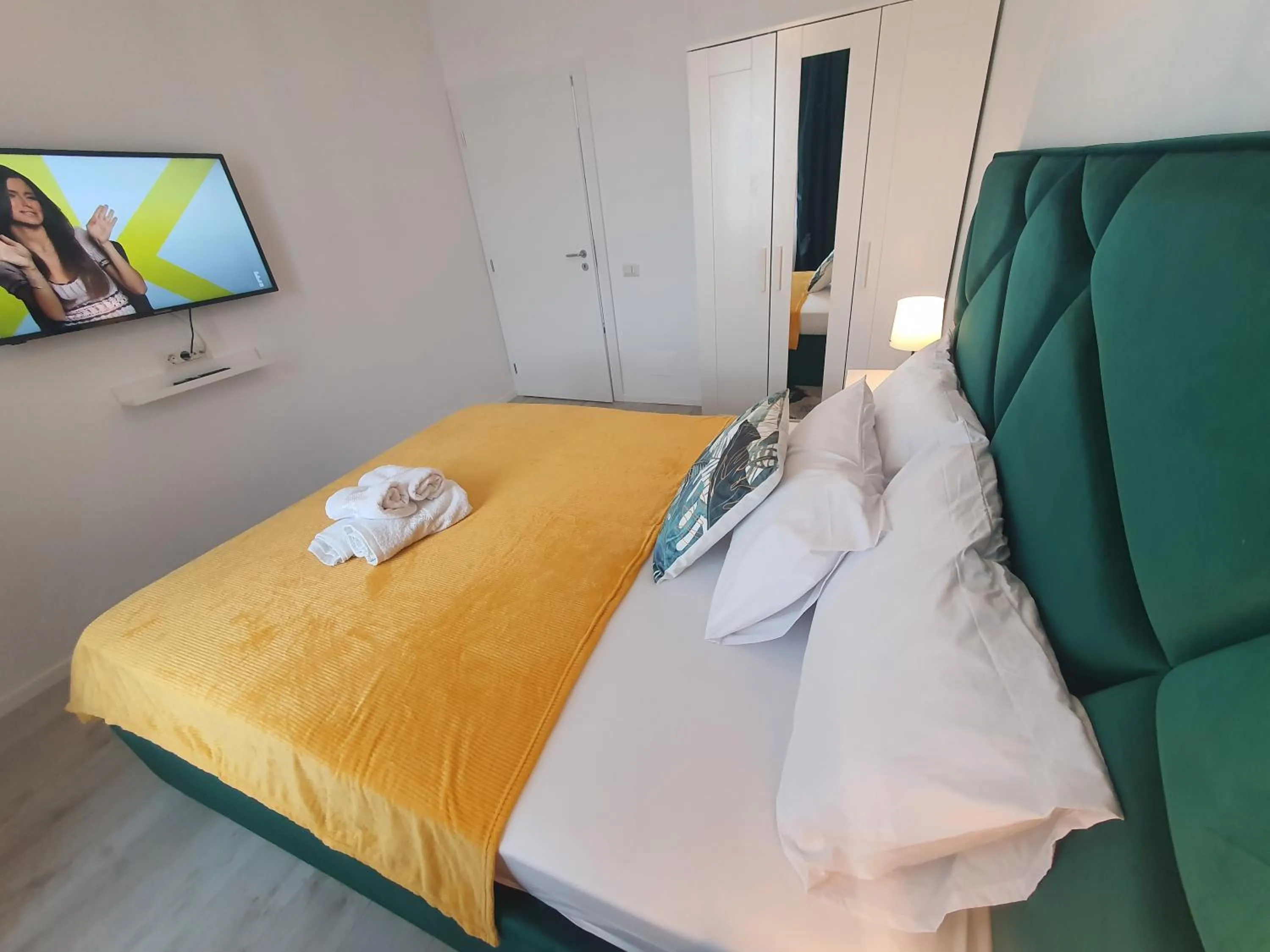 Bed in Grey Residence Apartments