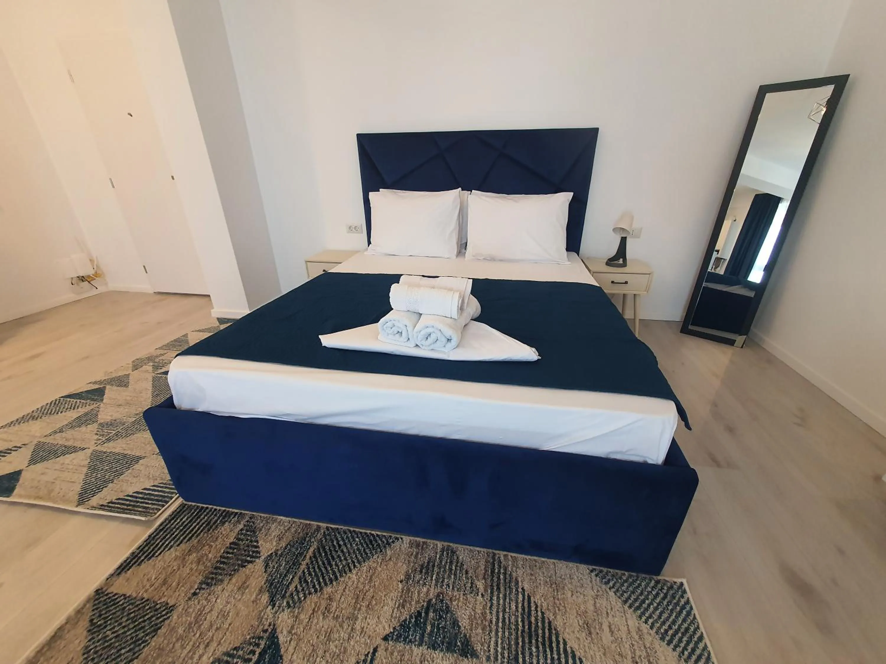 Bed in Grey Residence Apartments