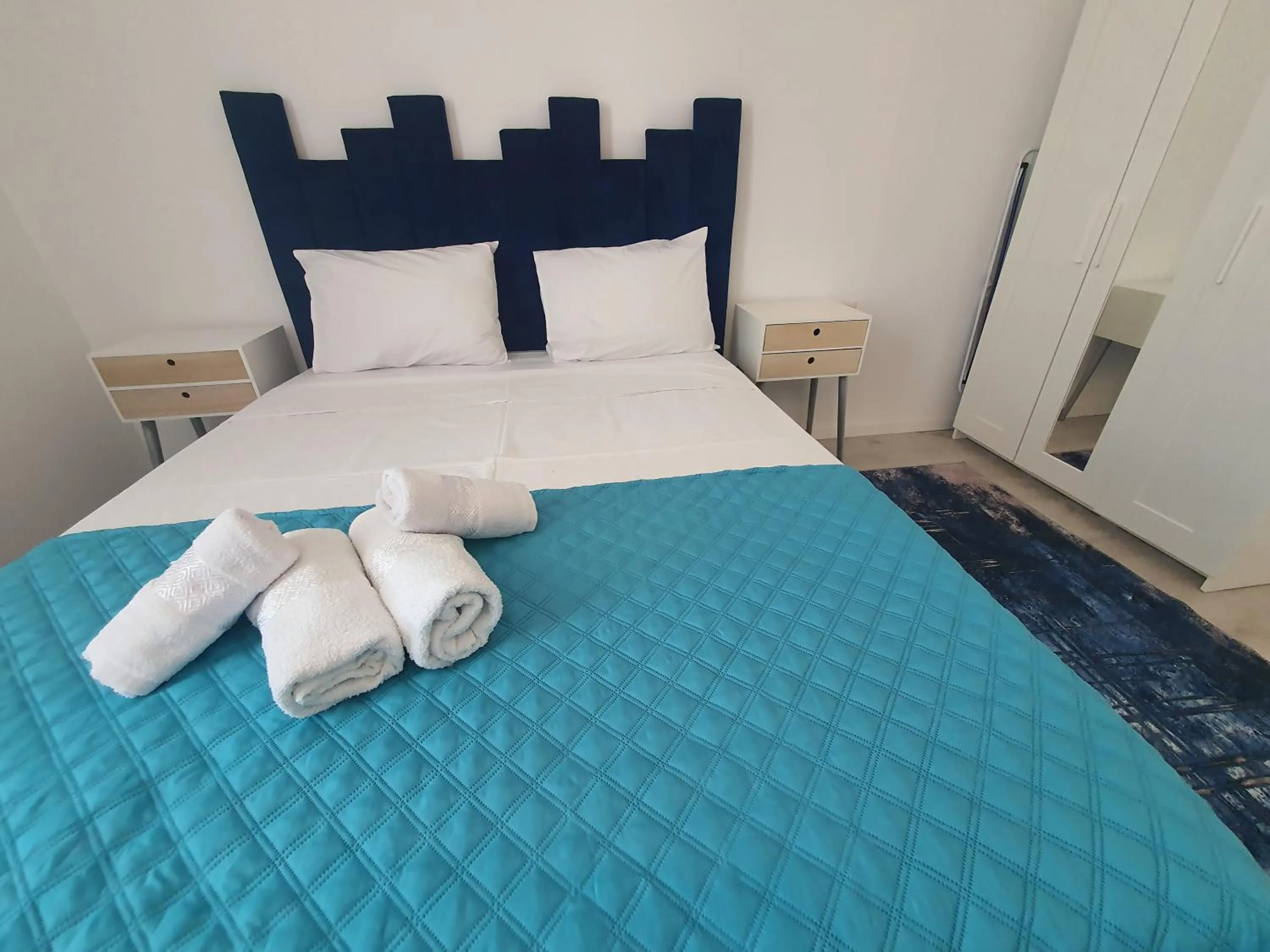 Bed in Grey Residence Apartments