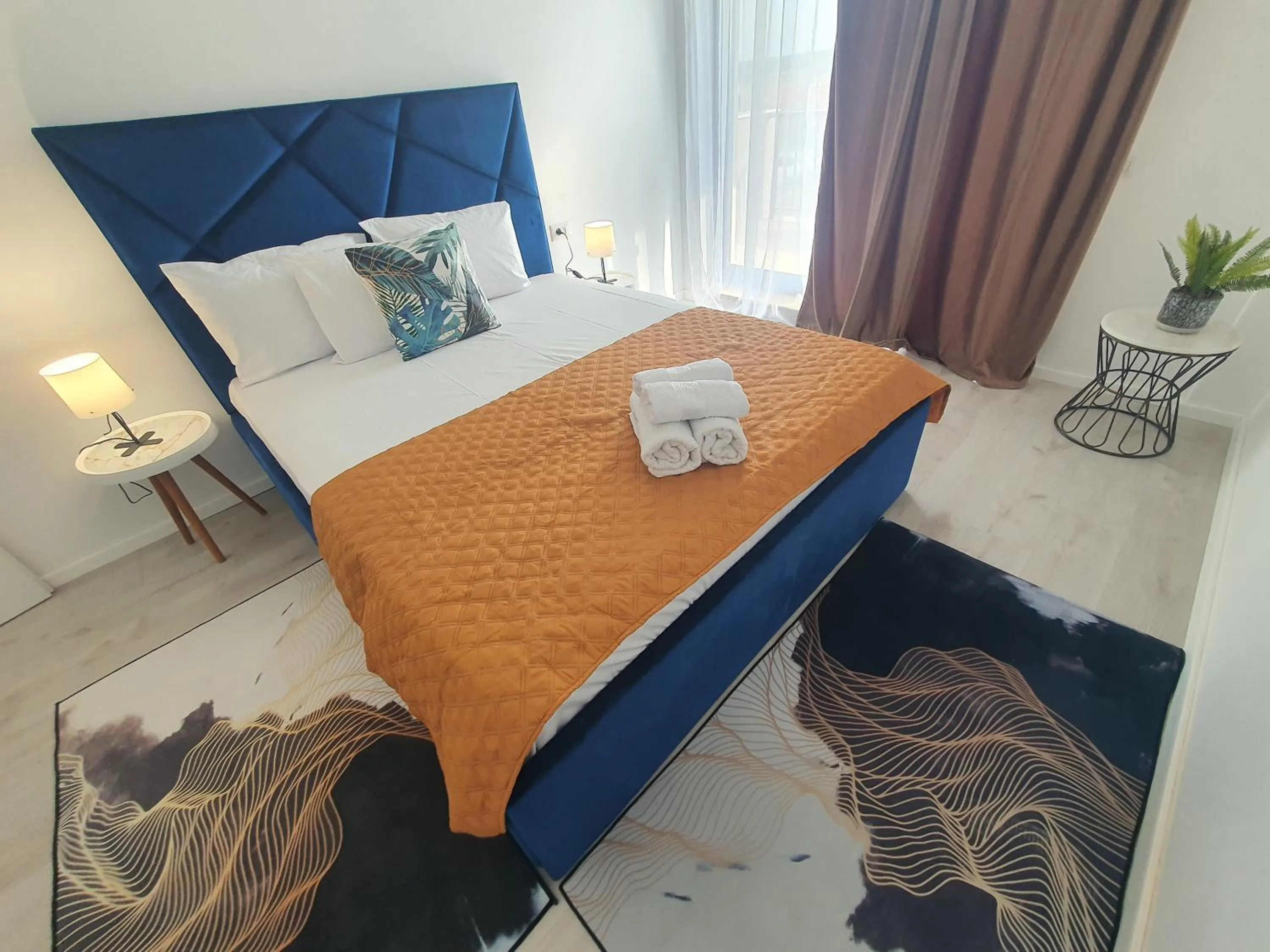 Bed in Grey Residence Apartments