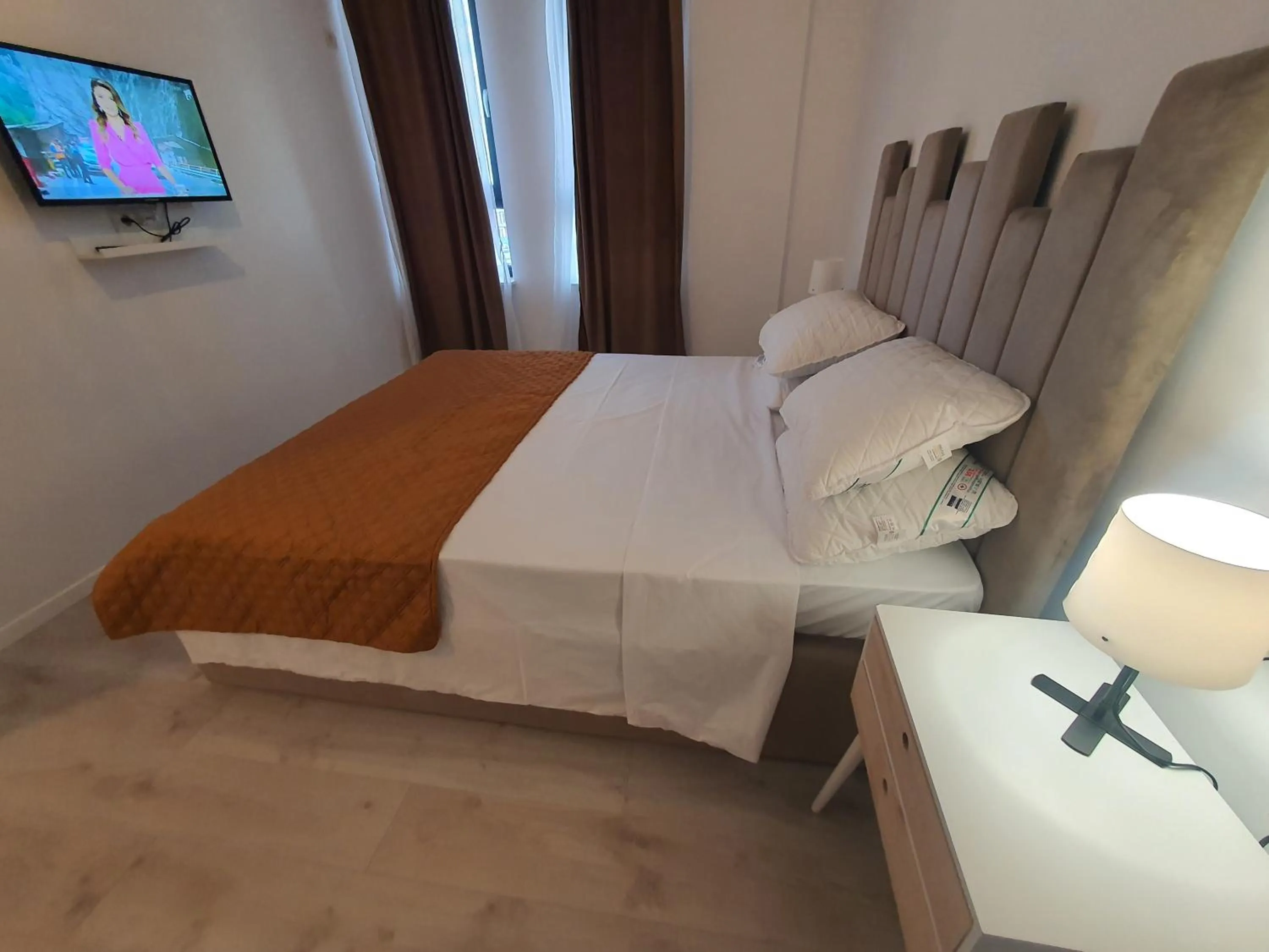 Bed in Grey Residence Apartments