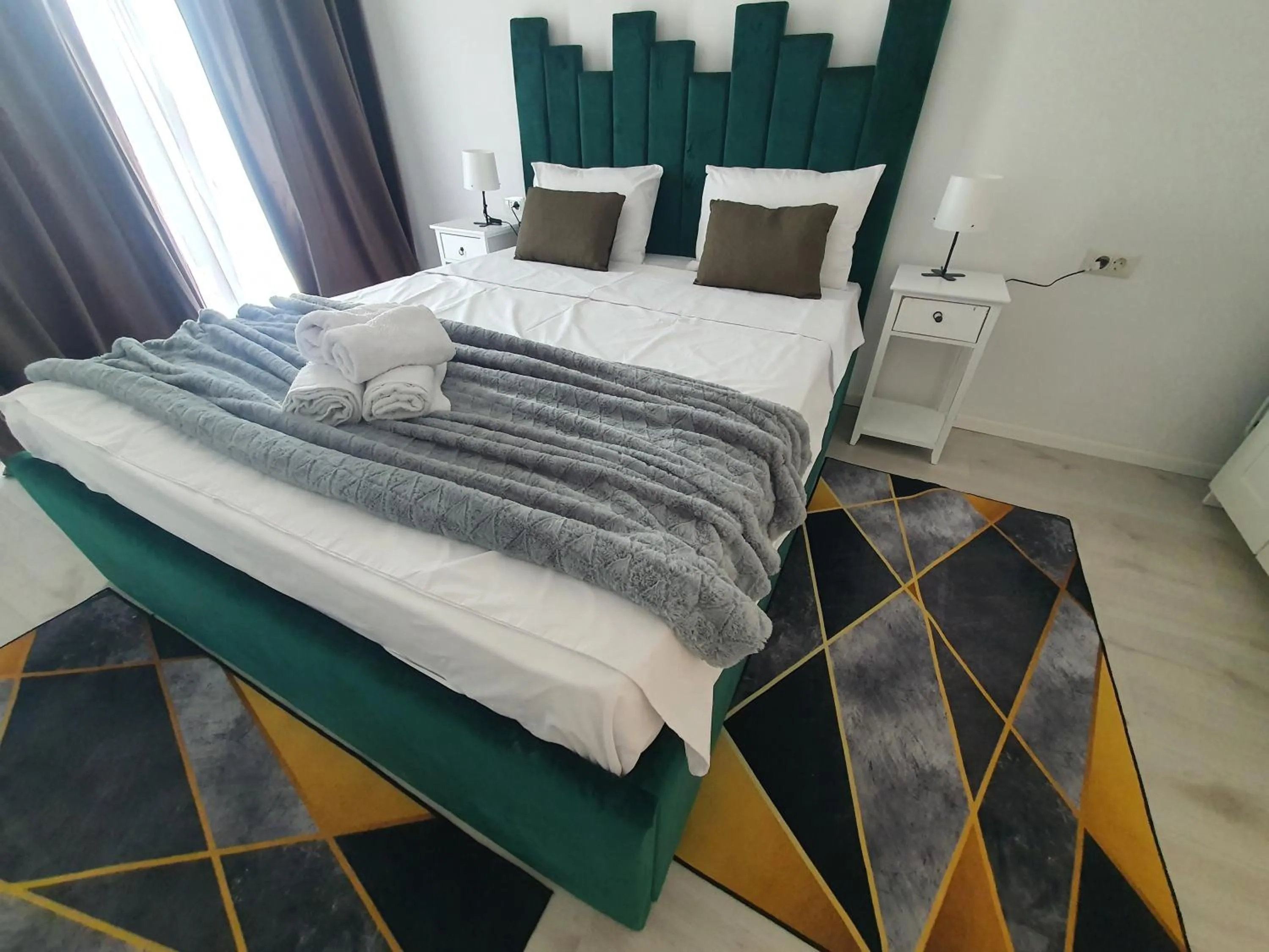 Bed in Grey Residence Apartments