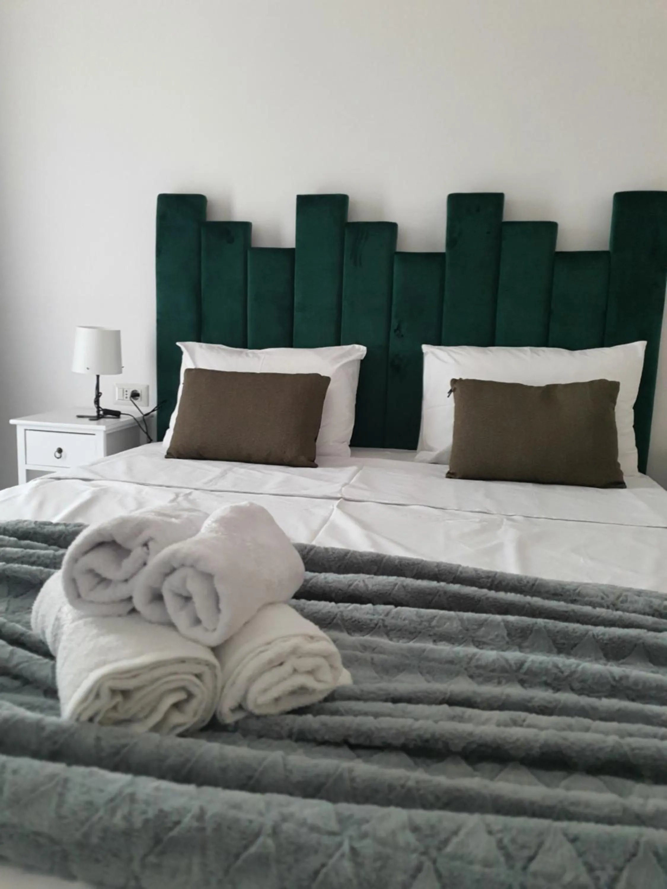 Bed in Grey Residence Apartments