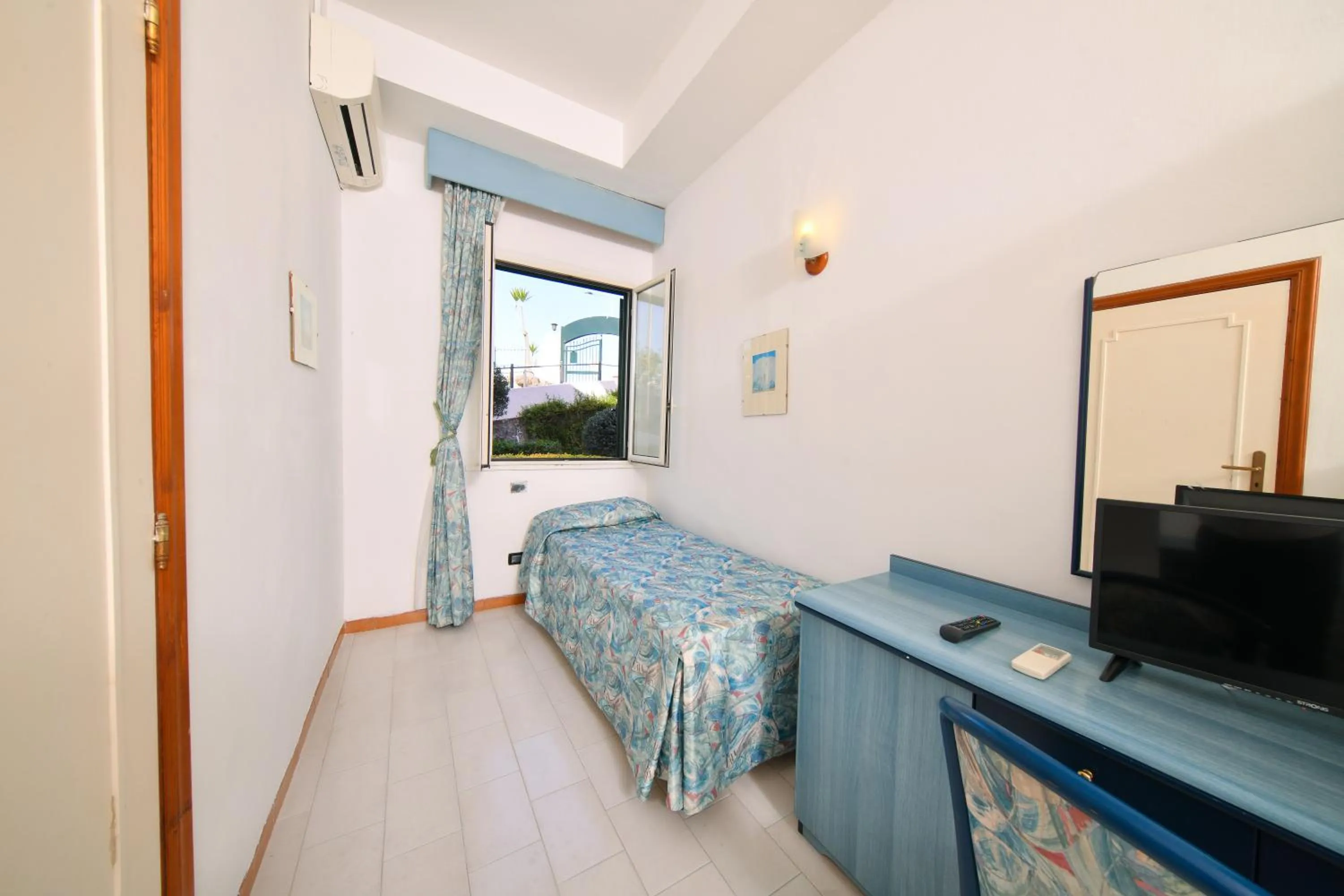 Photo of the whole room, TV/Entertainment Center in Fortuna Beach - Seaside Hotel