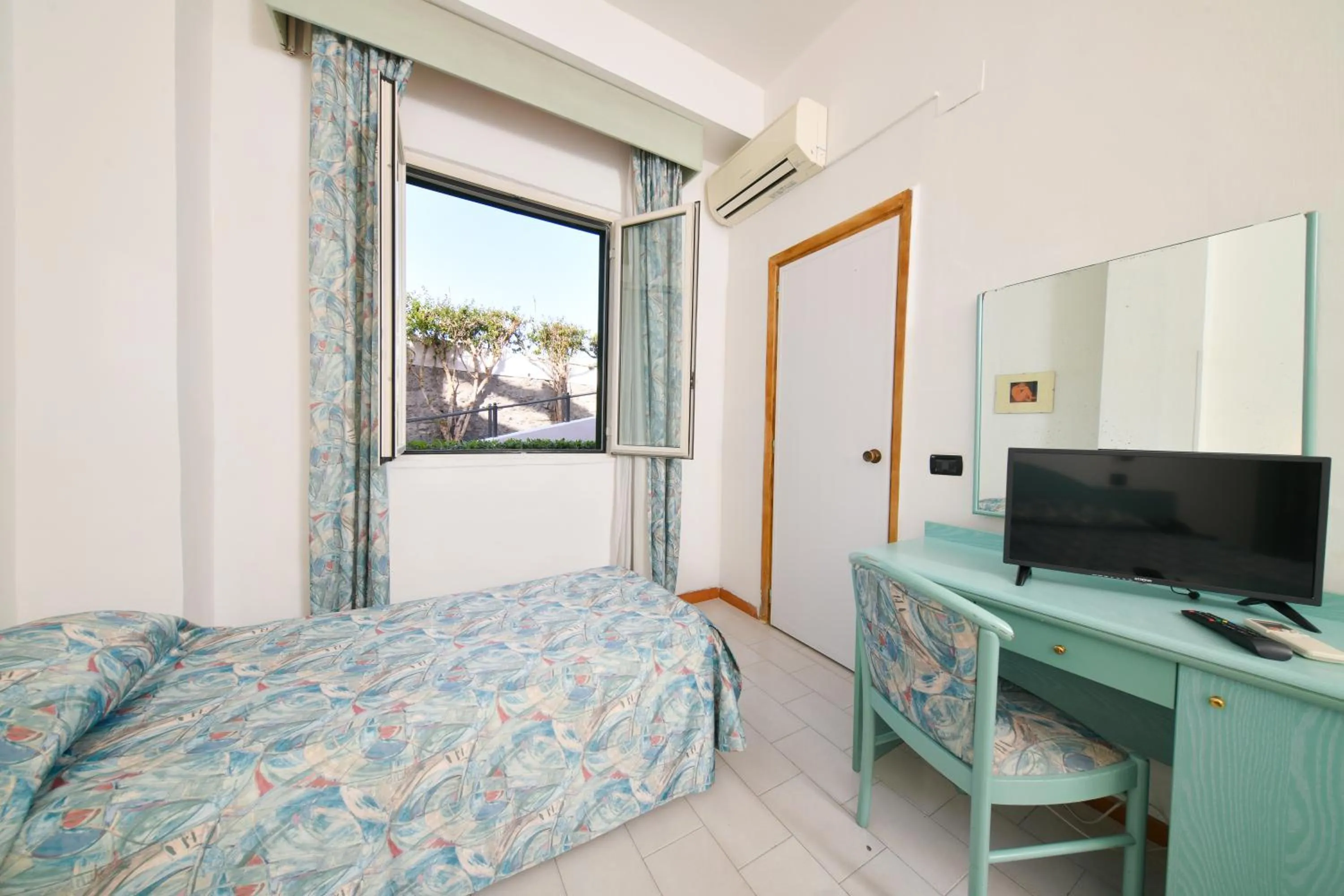 Photo of the whole room, TV/Entertainment Center in Fortuna Beach - Seaside Hotel