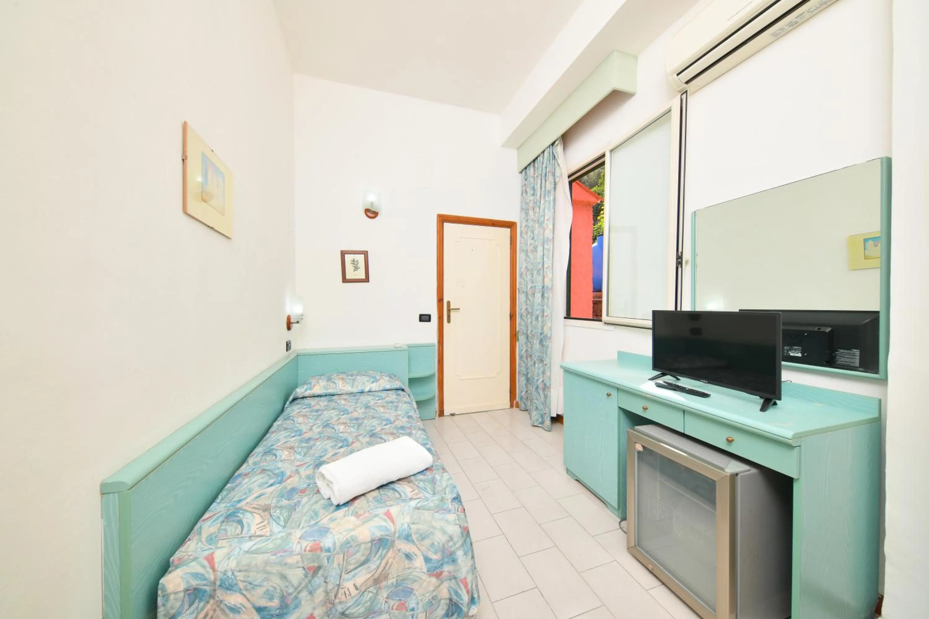 Photo of the whole room, TV/Entertainment Center in Fortuna Beach - Seaside Hotel