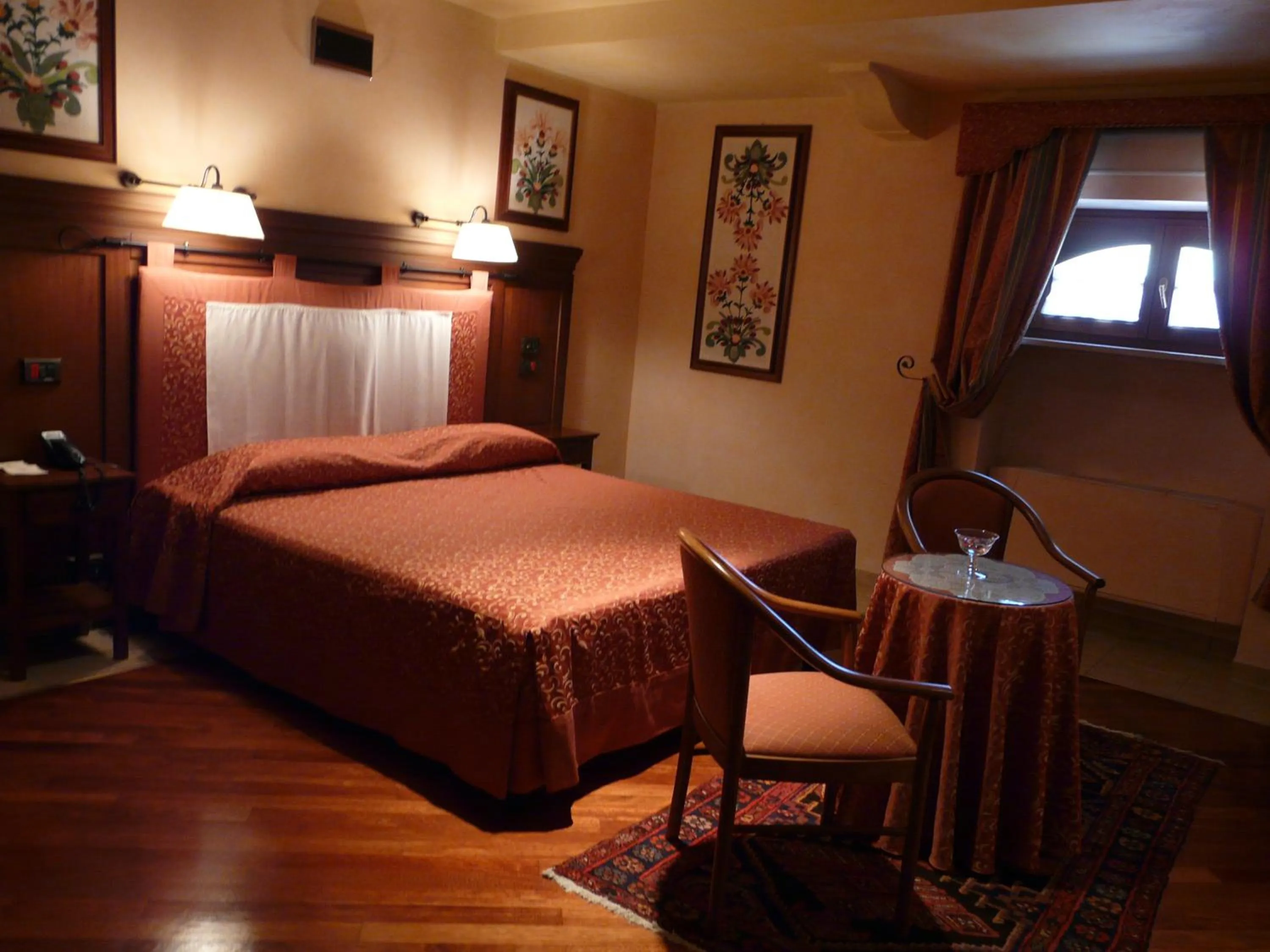 Bed in Relais Abbazia Santa Anastasia Resort & Winery