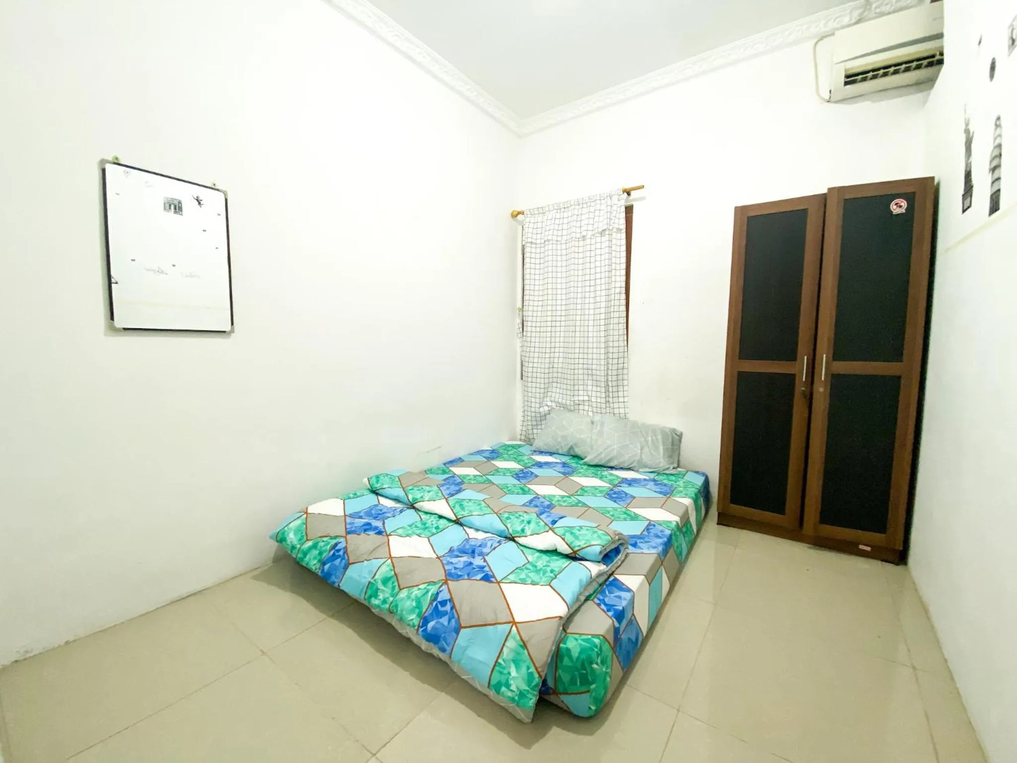 Bedroom, Bed in Homey Guesthouse Kertajaya (Syariah)