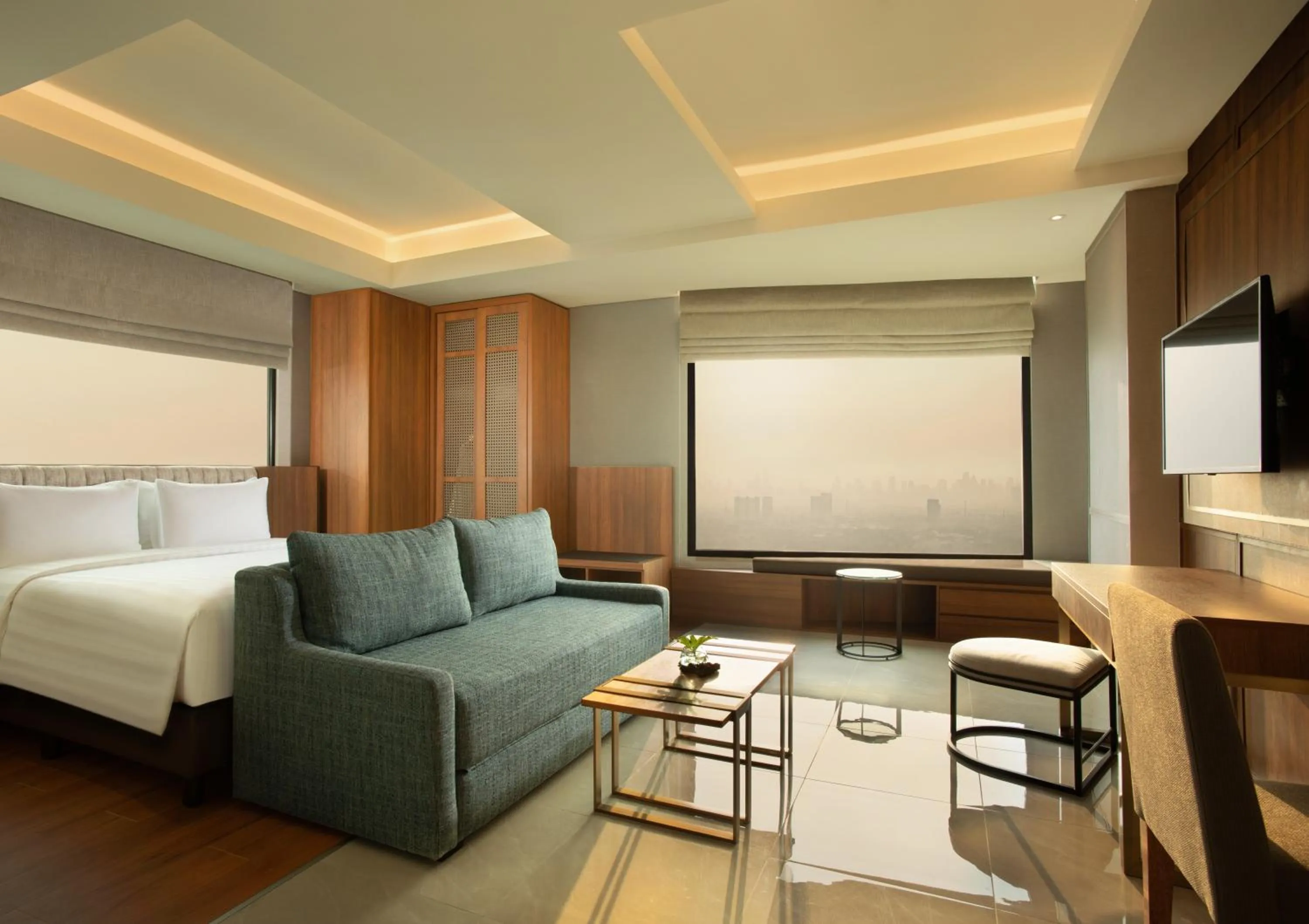 Living room, Bed in Trembesi Hotel