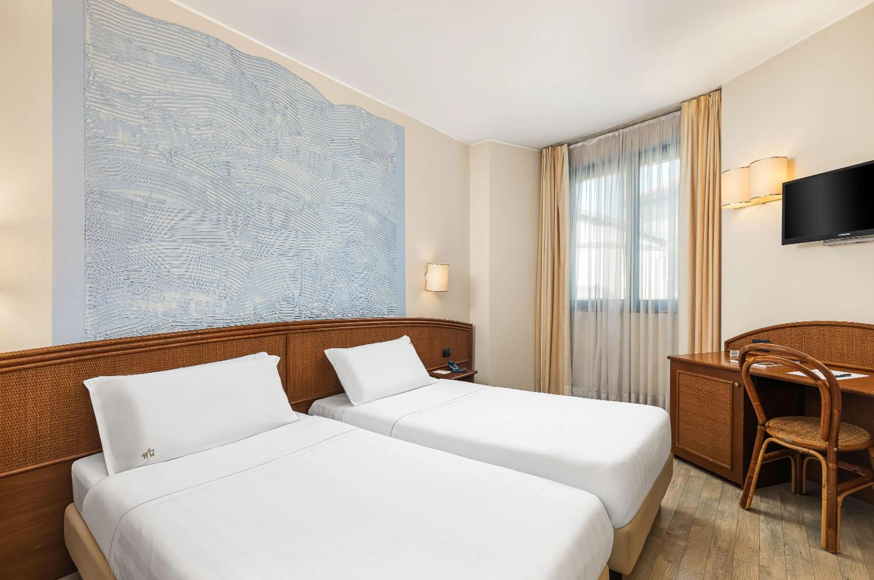 Bed in Welcome Hotel