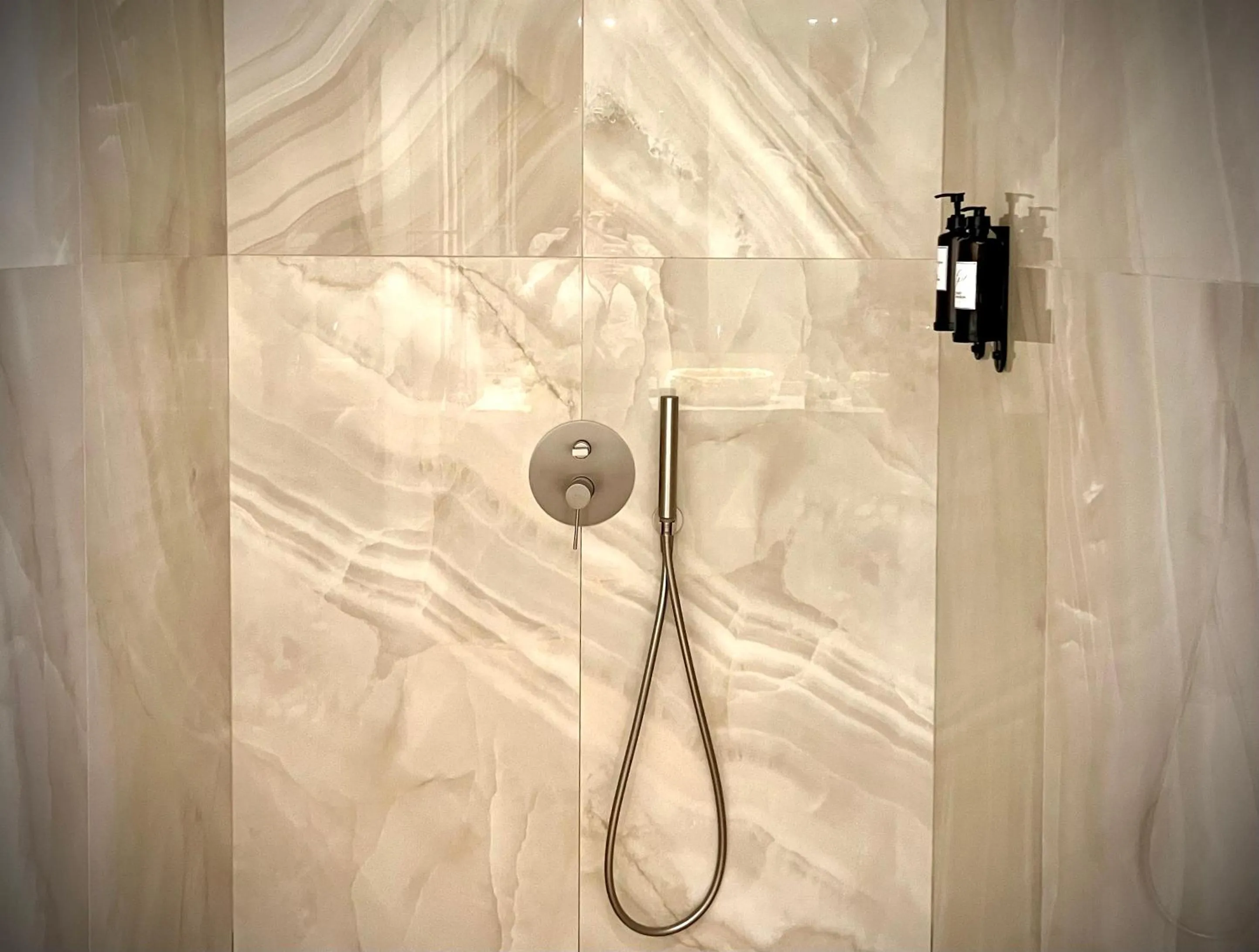 Shower in Comfy Studios Hotel