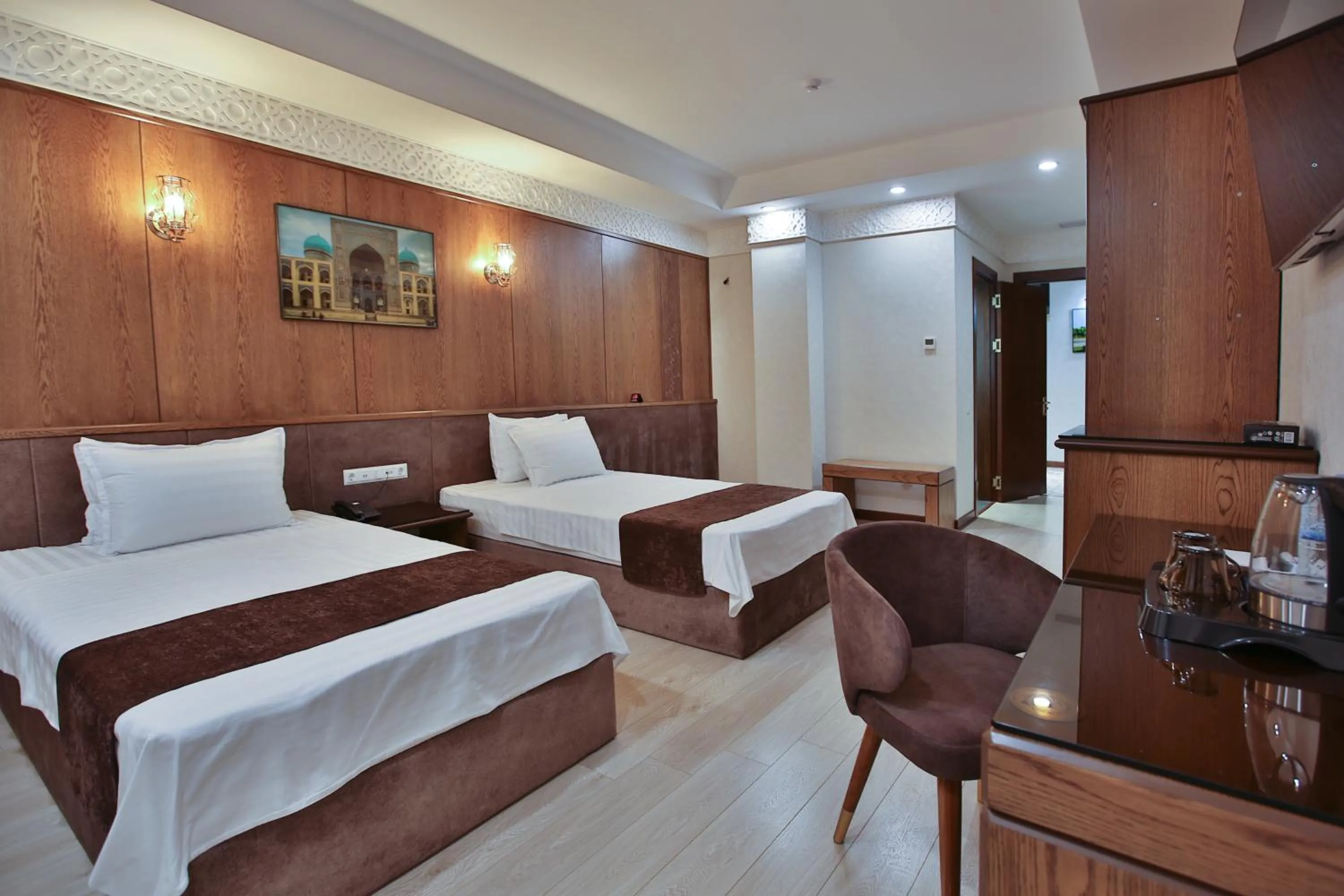 Bed in Paradise Plaza Luxury Hotel