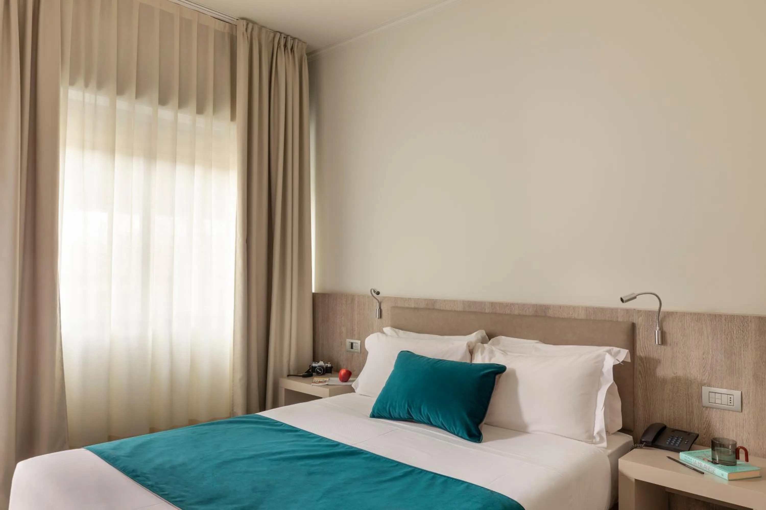 Bed in Living Hotel Milano