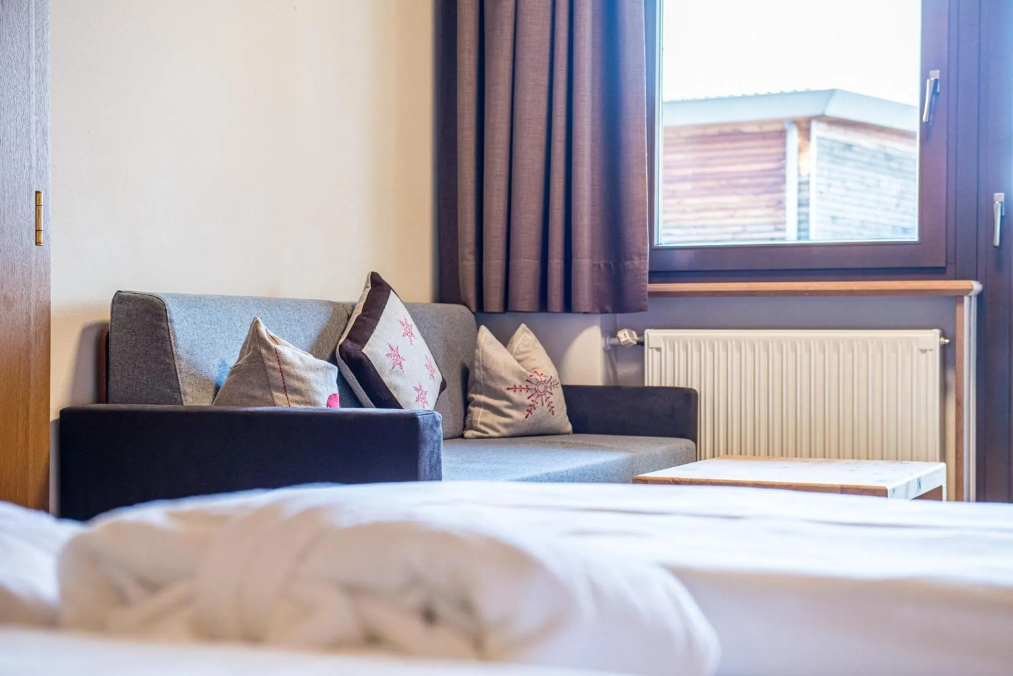 Seating area, Bed in Alphotel Stocker Alpine Wellnesshotel