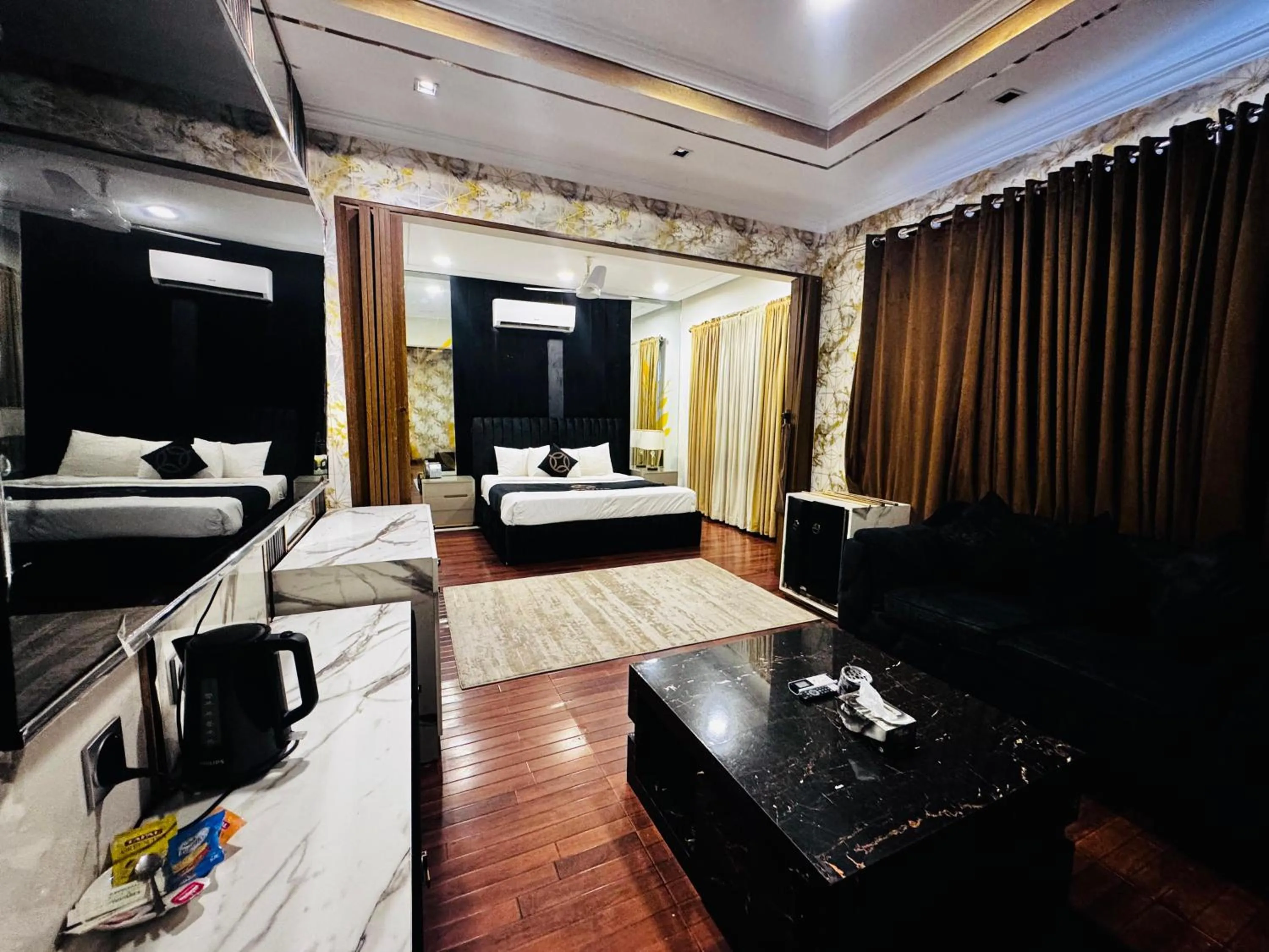 Communal lounge/ TV room, Bed in OXVUE Boutique Hotel