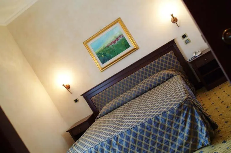 Bed in Hotel Don Carlo