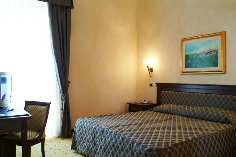 Bed in Hotel Don Carlo