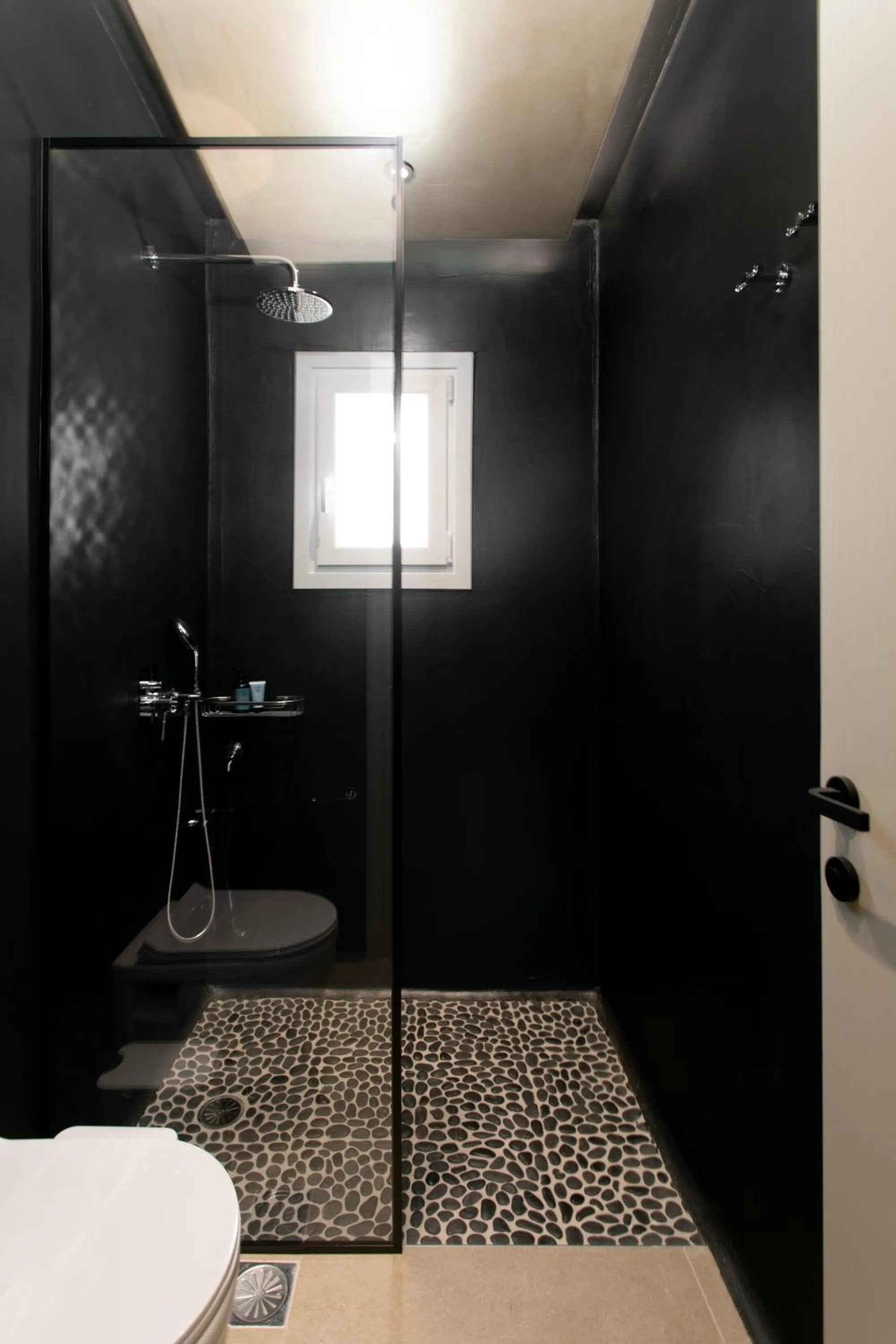 Shower in Eden Beachfront Residences & Suites