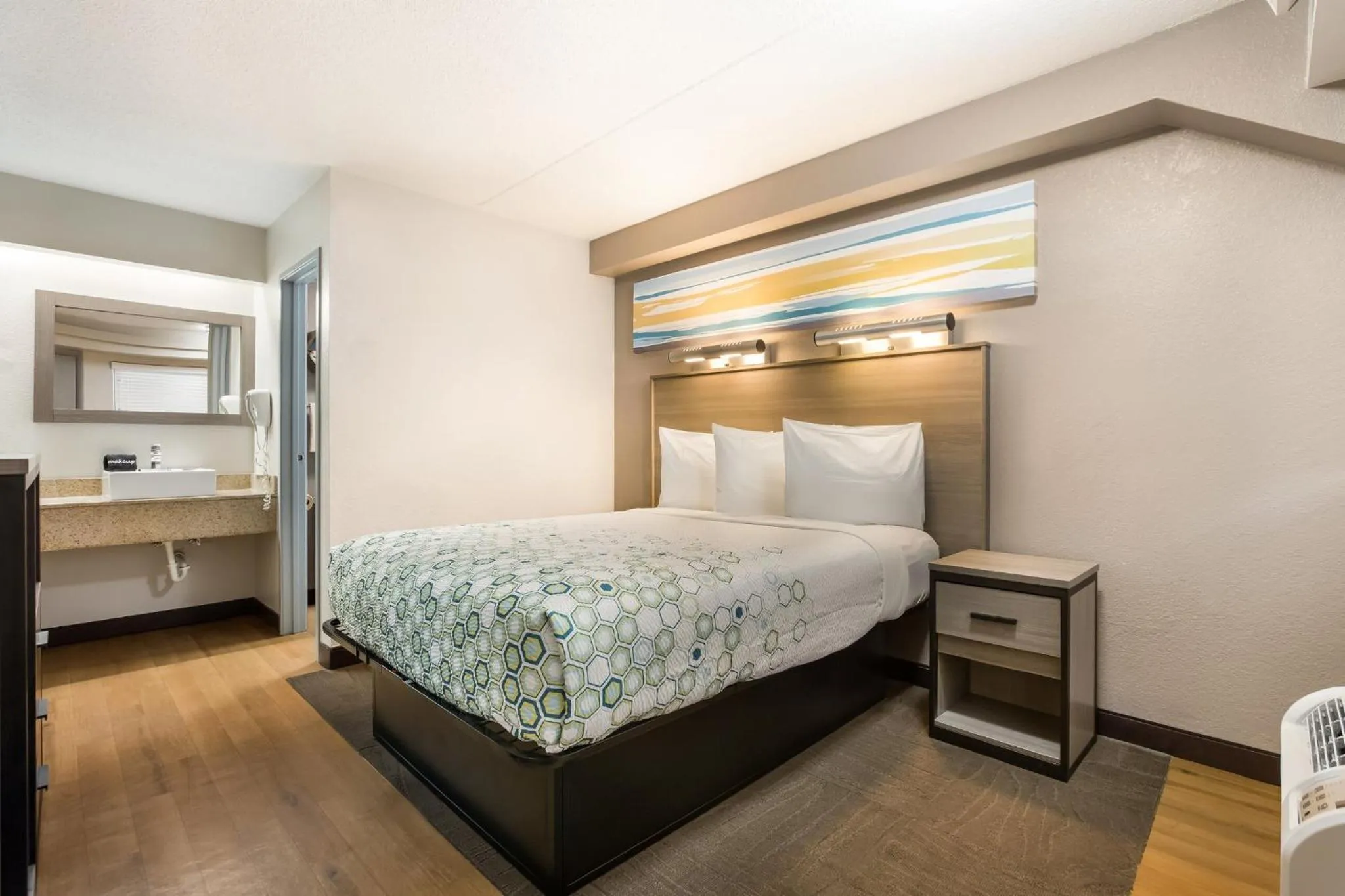 Bedroom, Bed in HomeTowne Studios by Red Roof Princeton - Ewing/ Lawrenceville