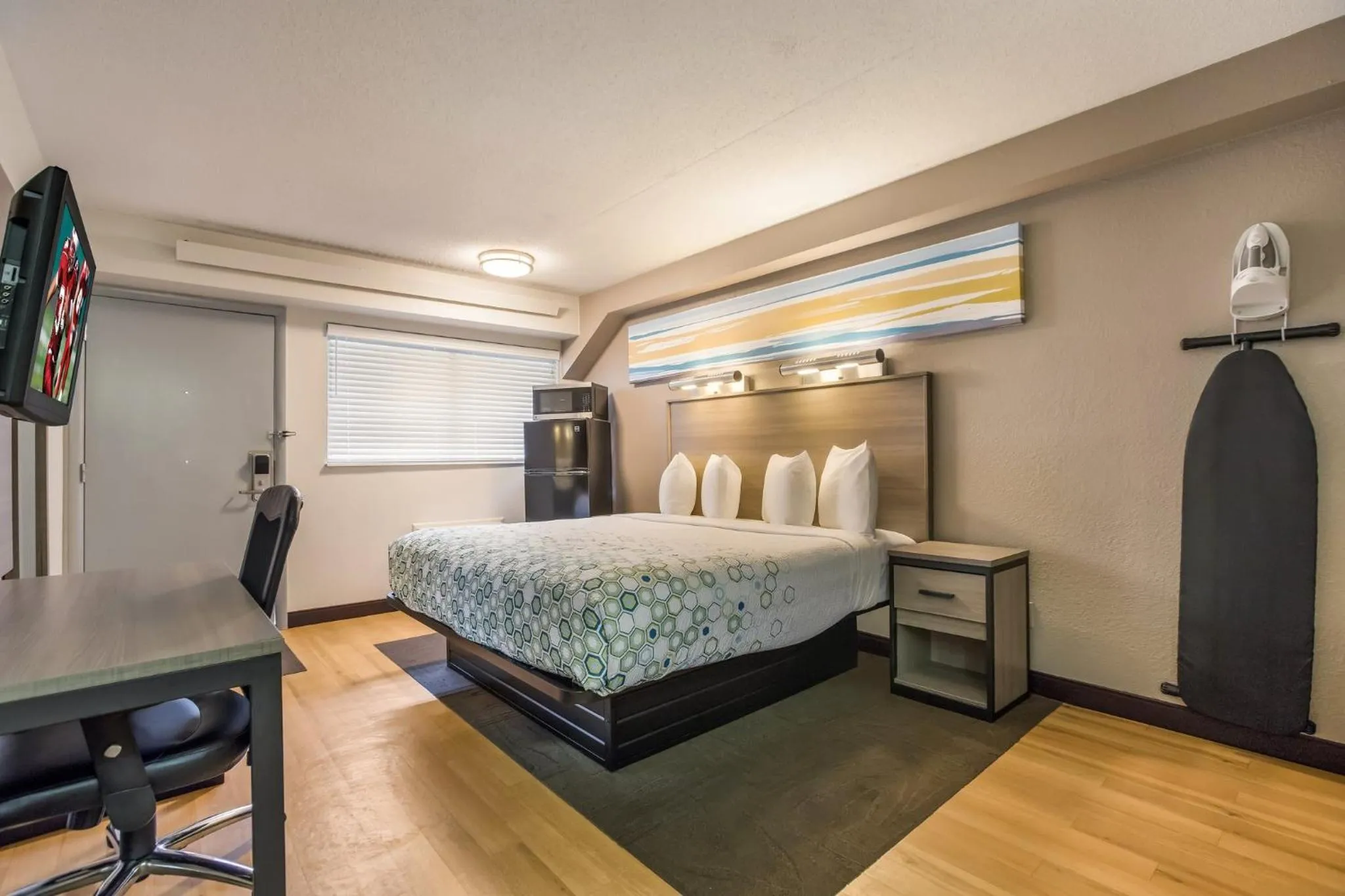 Bedroom, Bed in HomeTowne Studios by Red Roof Princeton - Ewing/ Lawrenceville