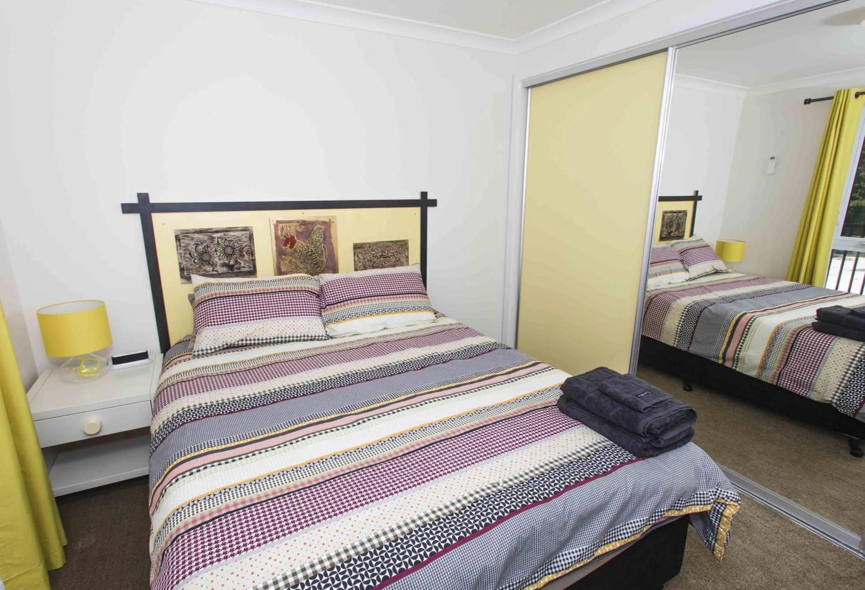 Bed in One of a Kind Apartments