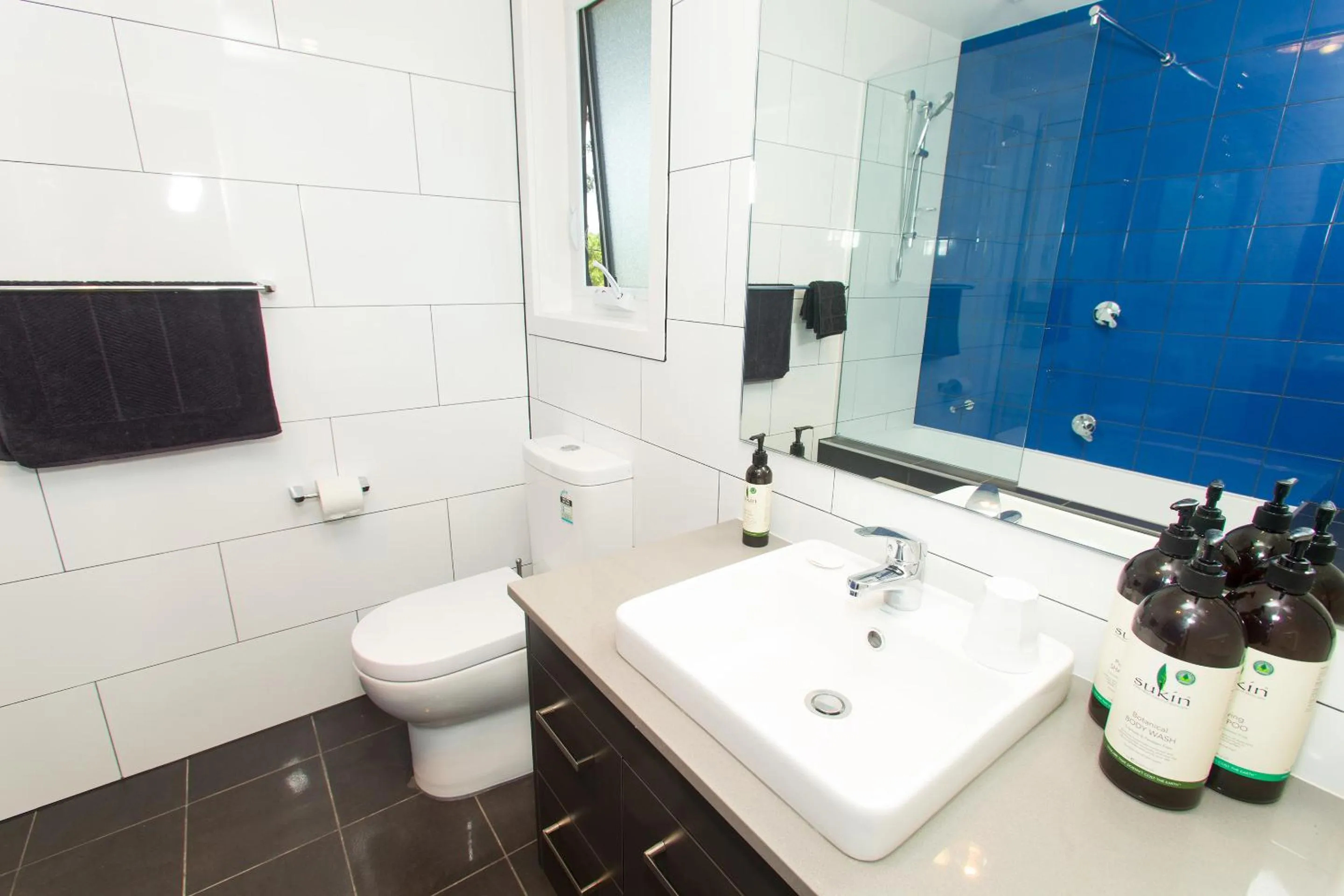 Toilet, Bathroom in One of a Kind Apartments