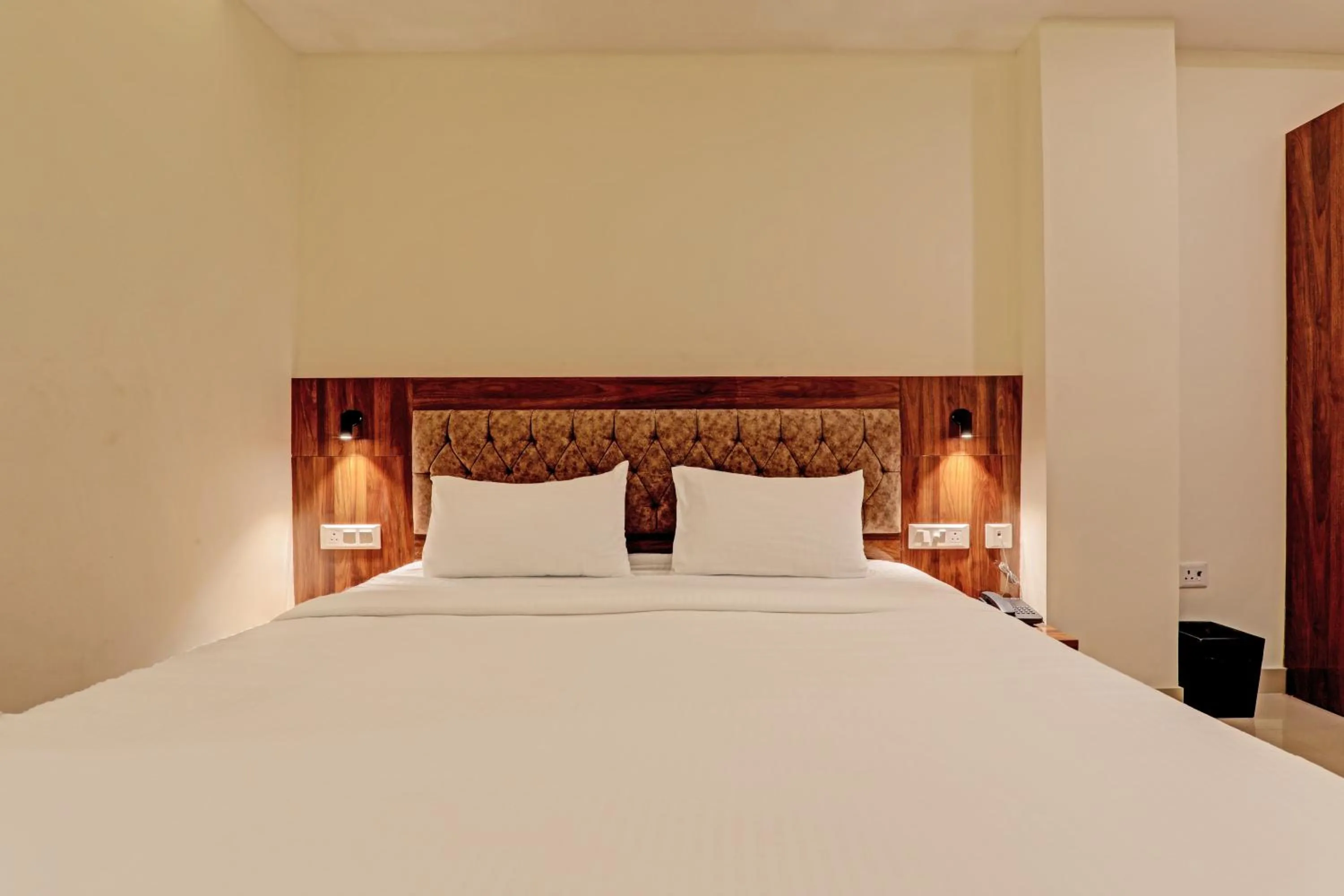 Bed in Hotel Heera Grand