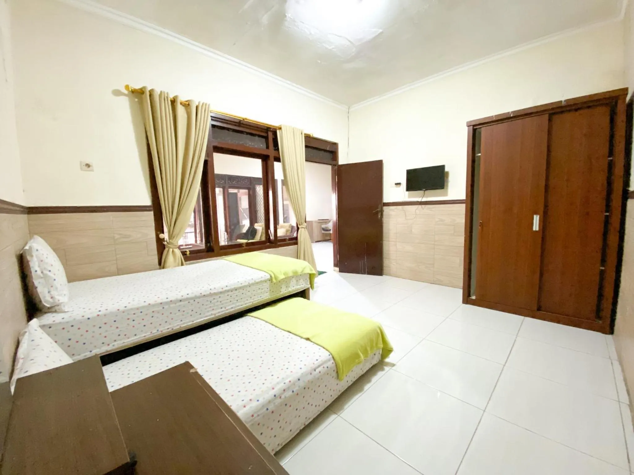 Photo of the whole room in Homey Guesthouse near Sby Zoo Syariah