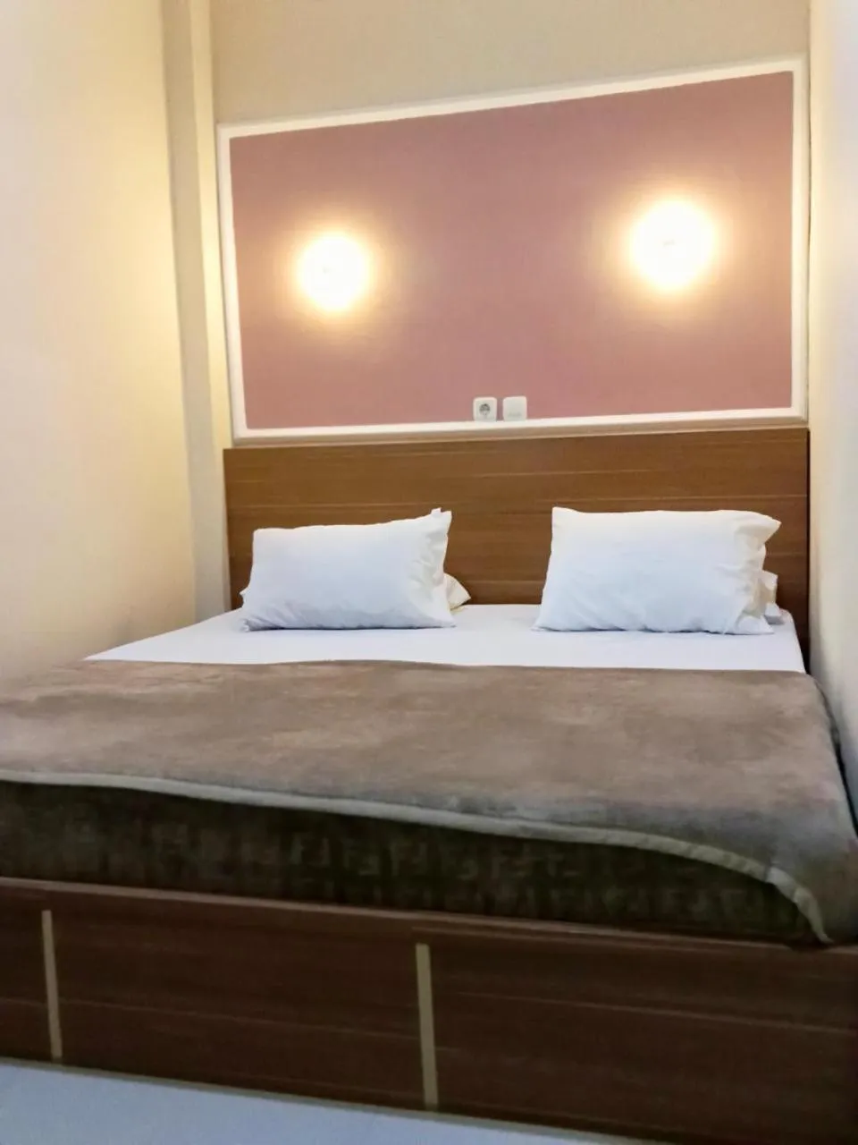 Bed in Al-Kiswah Syariah Guest House