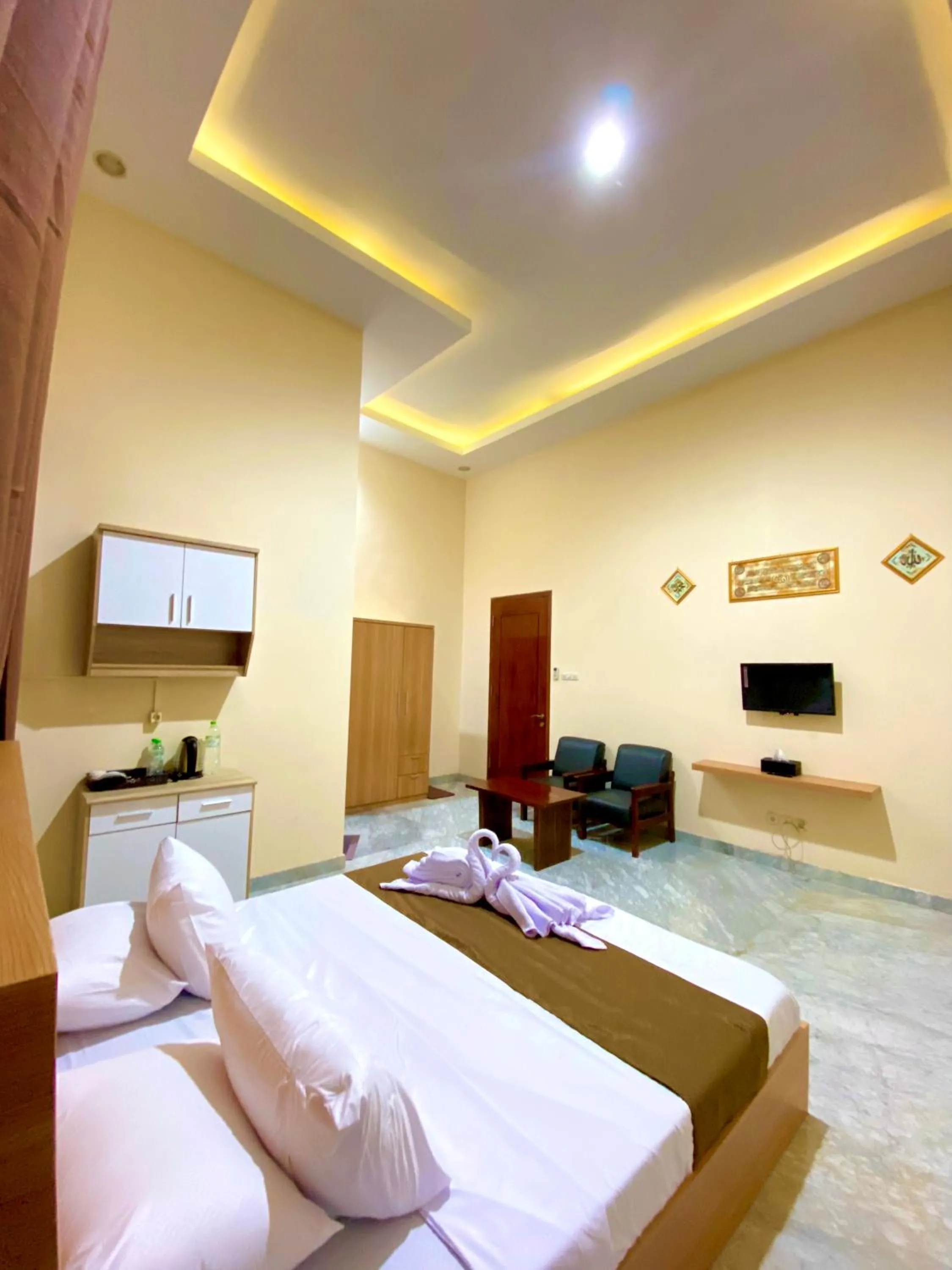 Bed in Al-Kiswah Syariah Guest House