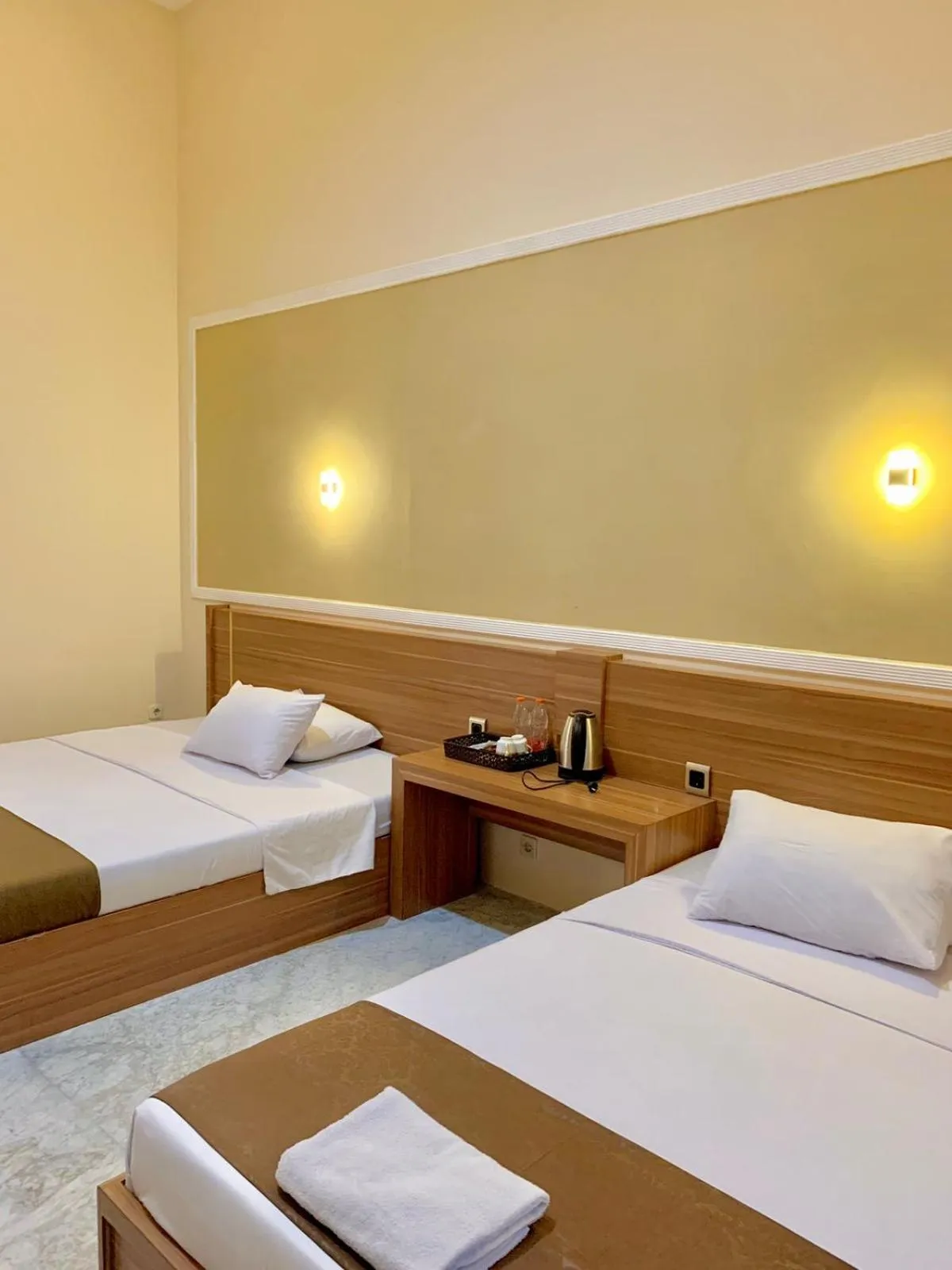 Bed in Al-Kiswah Syariah Guest House