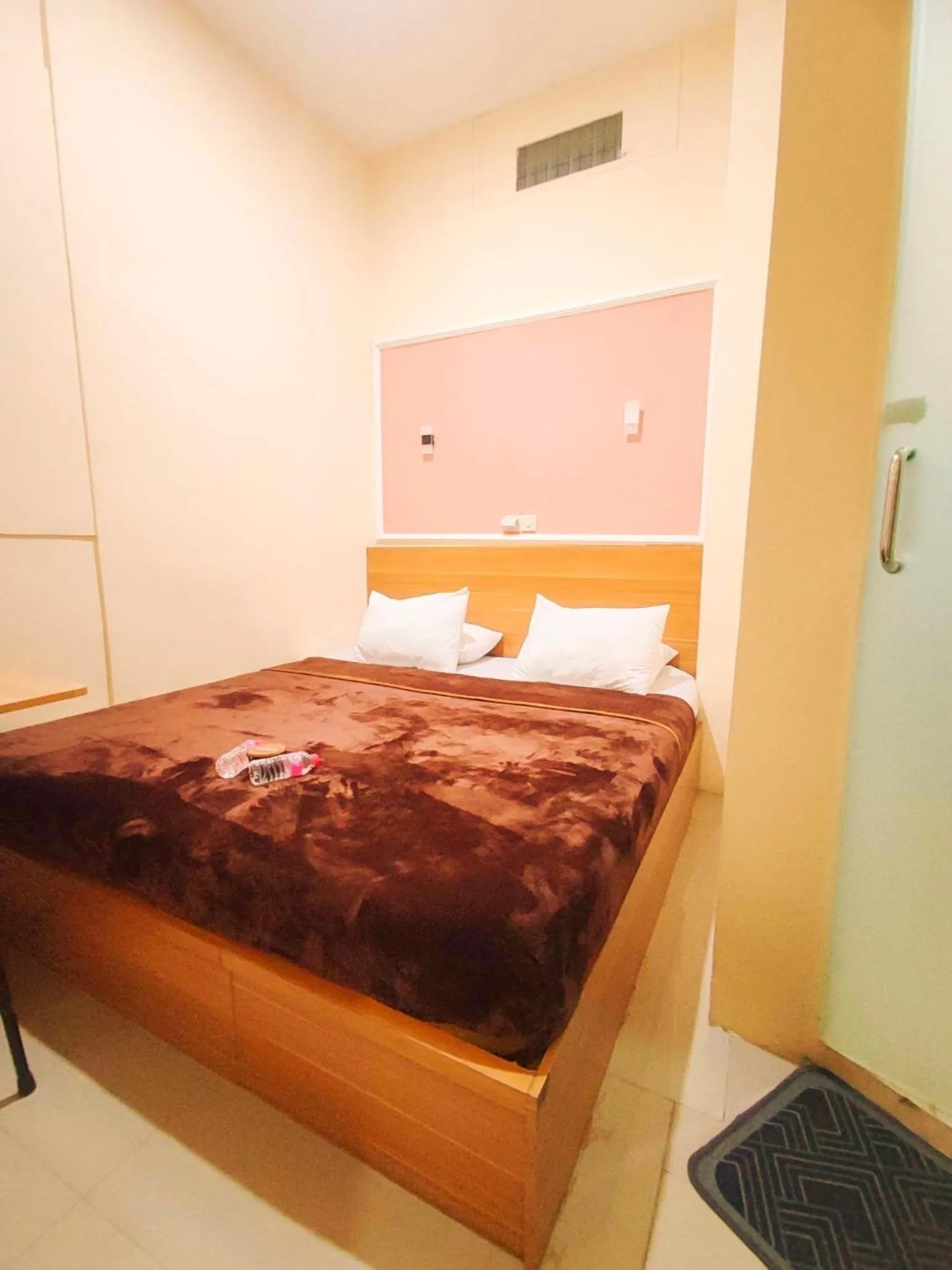 Bed in Al-Kiswah Syariah Guest House