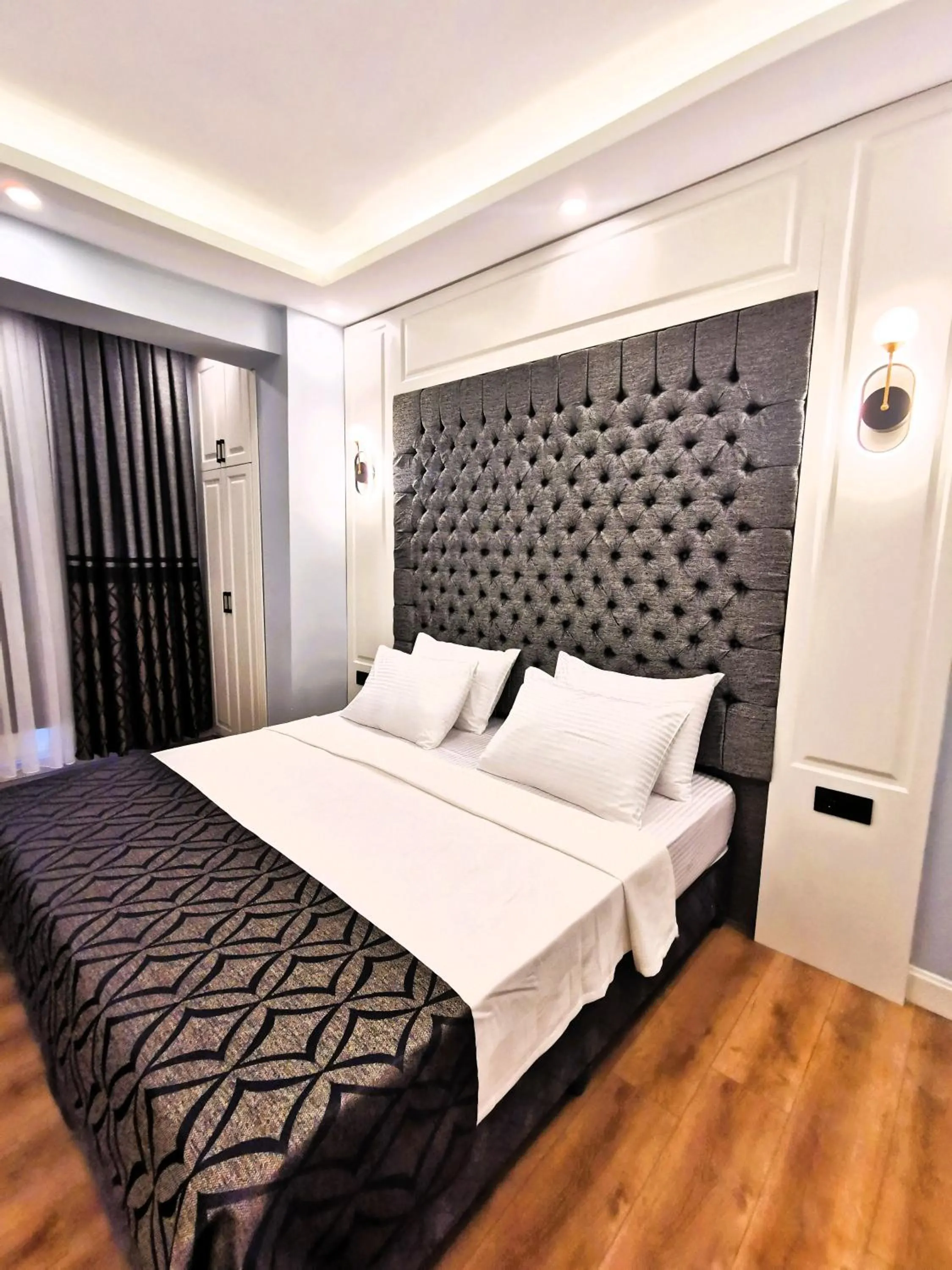 Bed in Luxx Garden Hotel