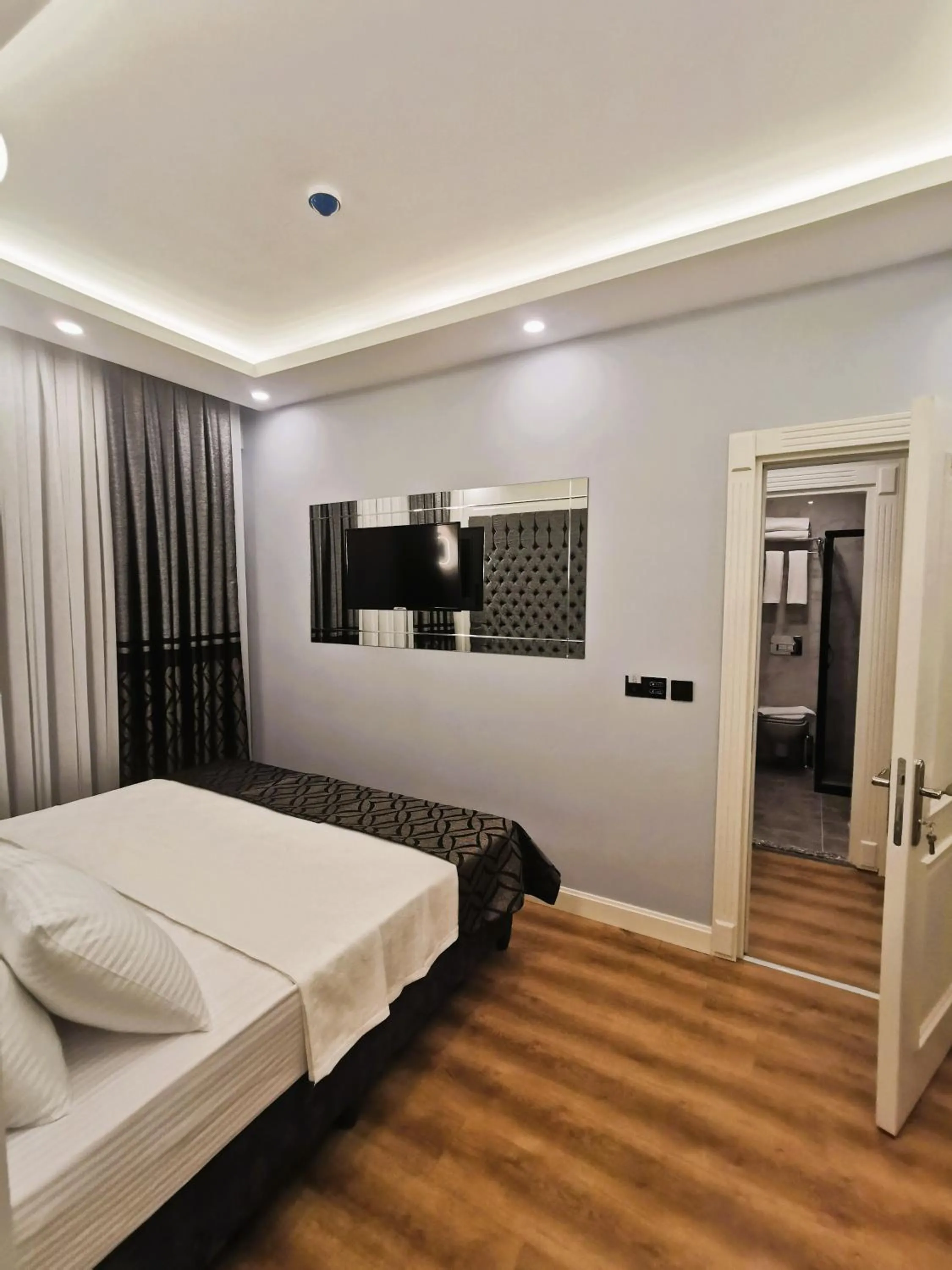 Photo of the whole room, Bed in Luxx Garden Hotel