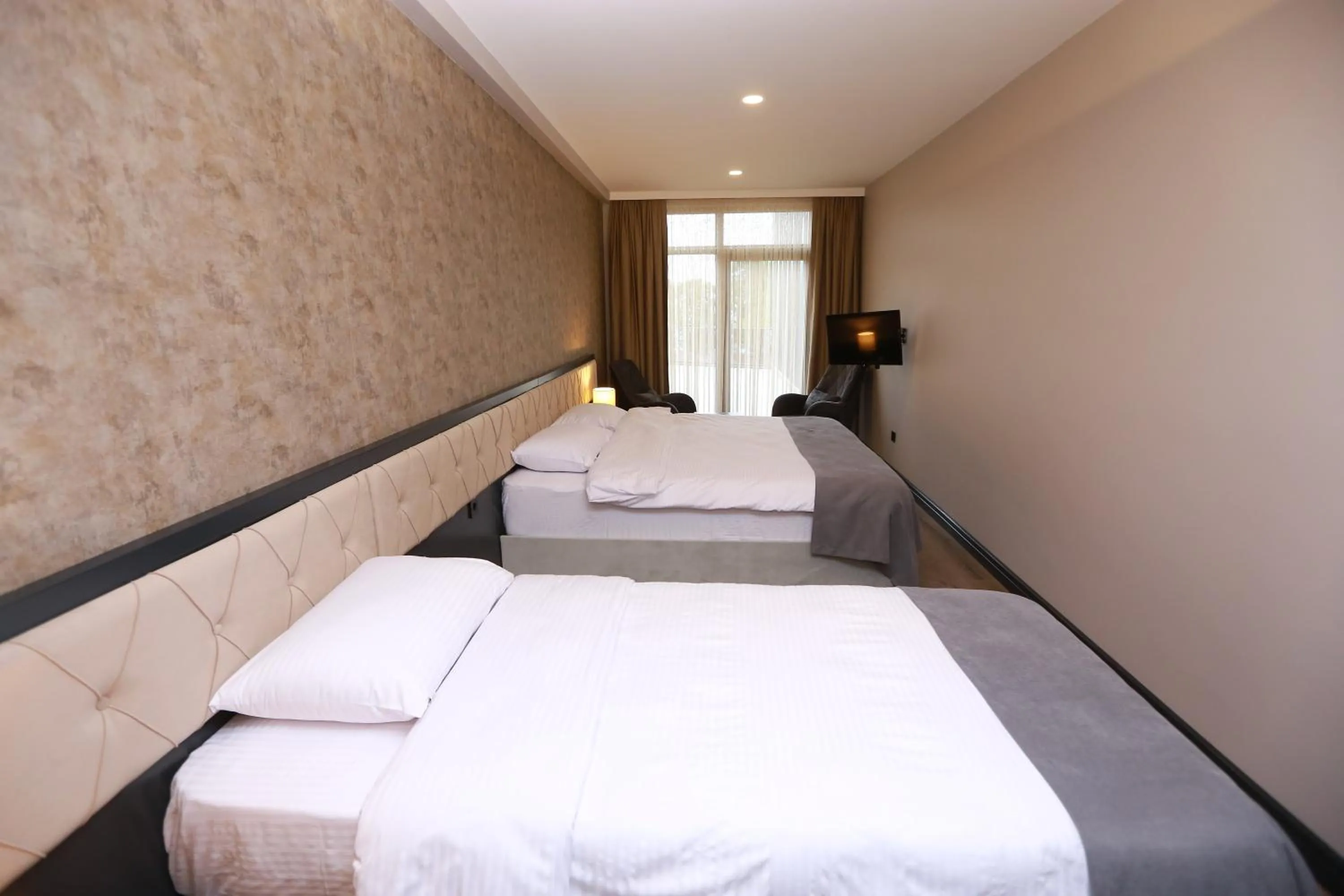 Bed in PENTAHOR HOTEL