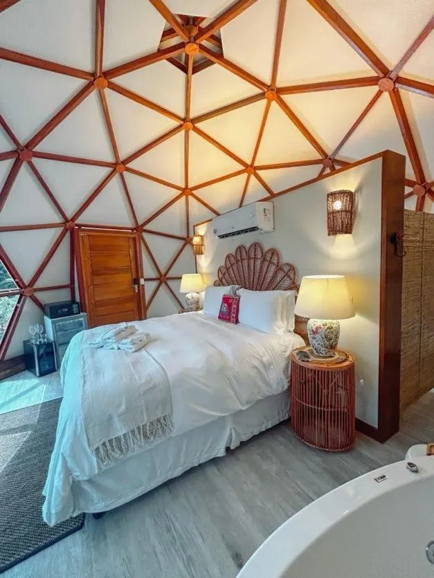 Bed in Embaúba Boutique Hotel