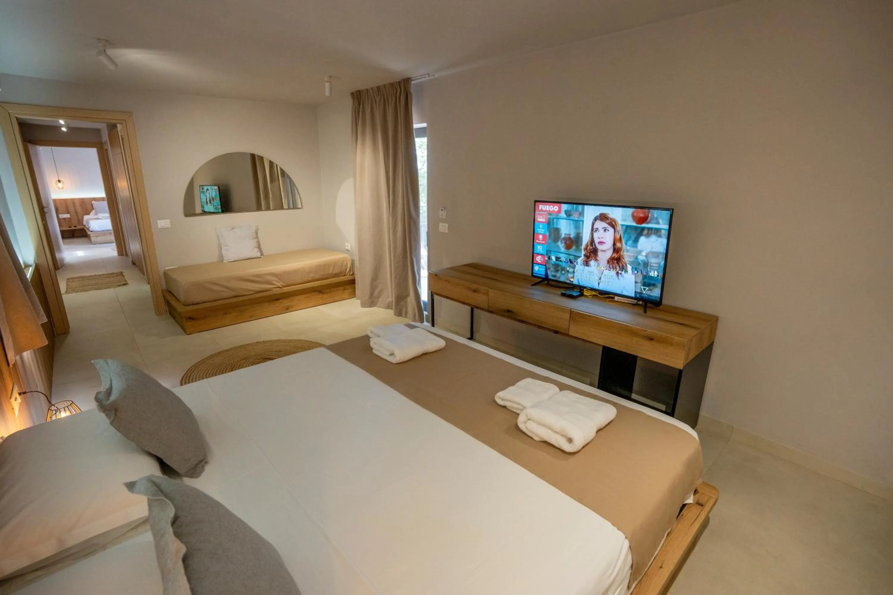 Communal lounge/ TV room, Bed in Arameras Beach Resort