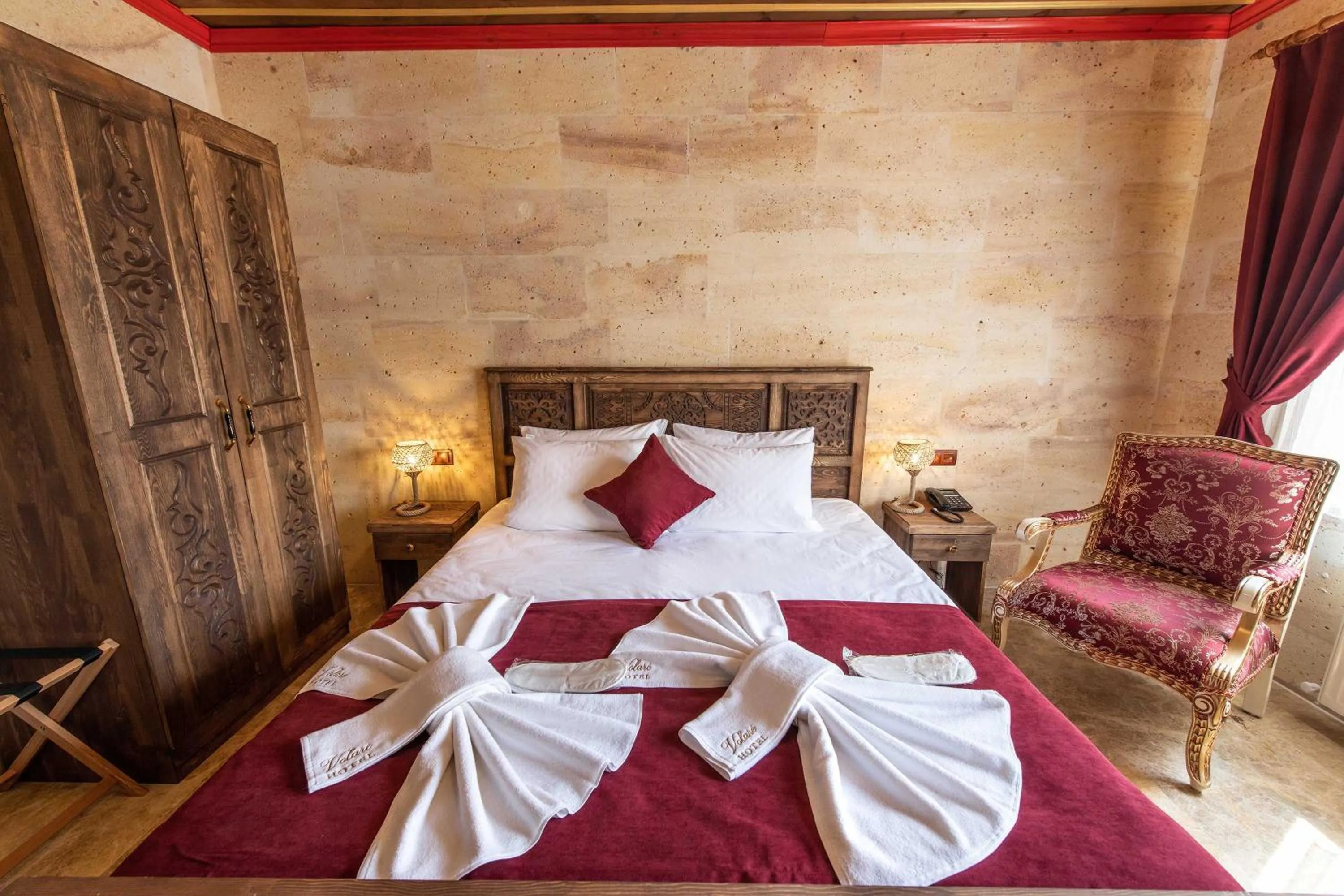 Bed in Volare Stone Hotel
