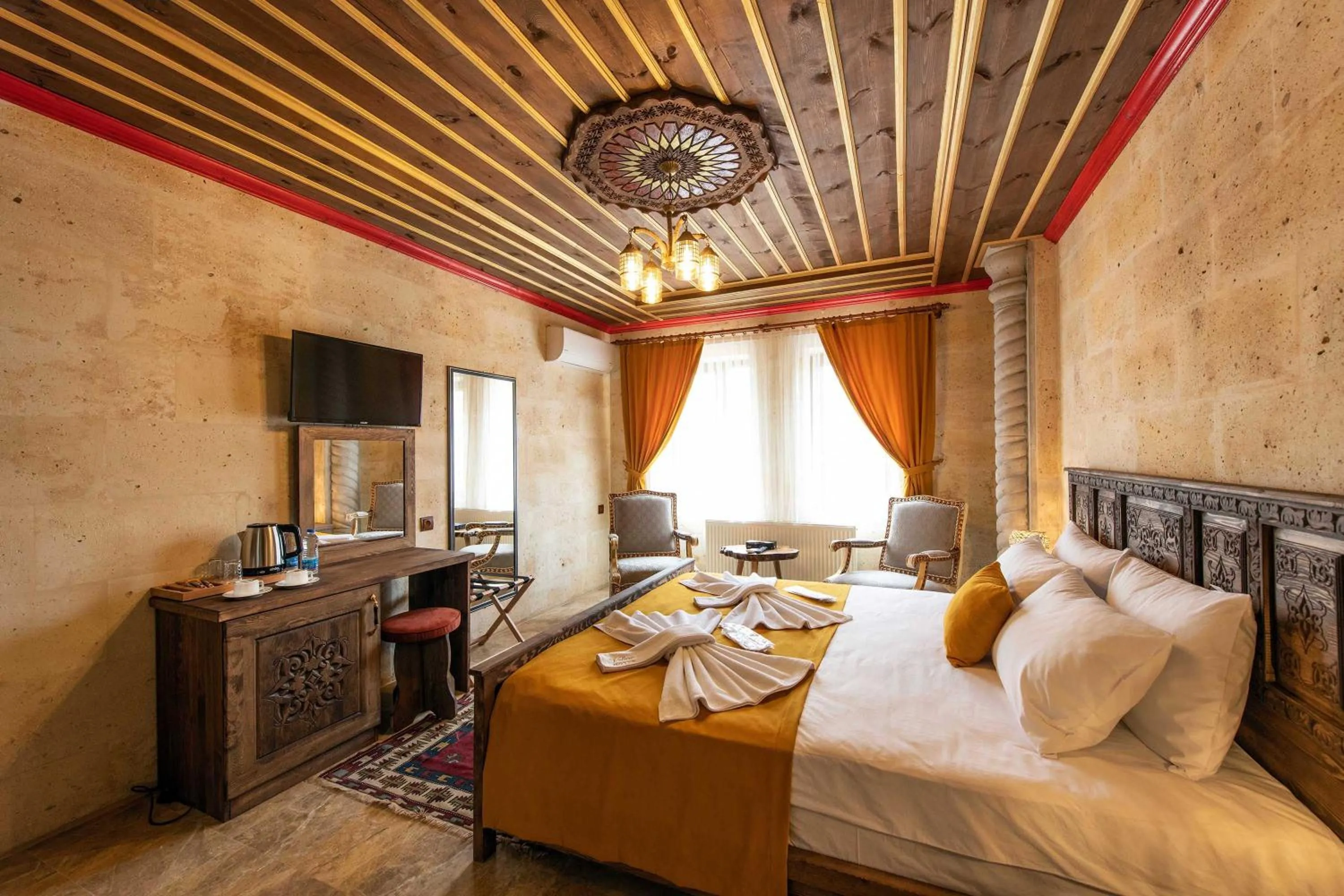 Bed in Volare Stone Hotel